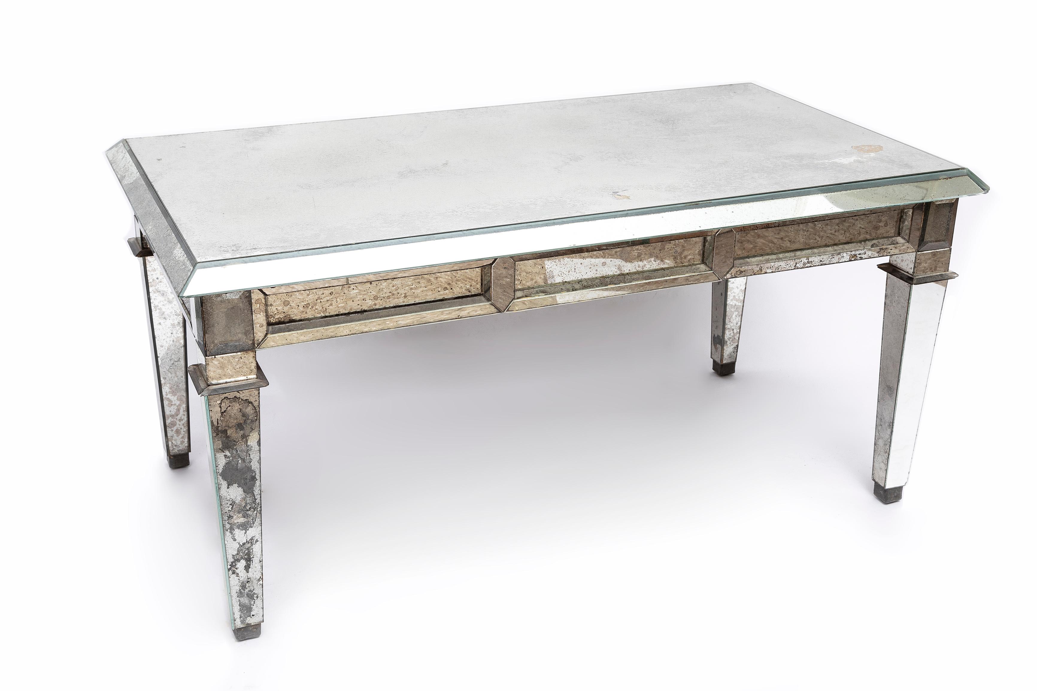 A Fantastic French Mid Century Mirrored Coffee Table by Jansen. All- faceted, inset mirrored top, skirts and legs, this mirrored coffee table is a prominent interior design masterpiece and is exceptionally rare.  Mirrored coffee tables were