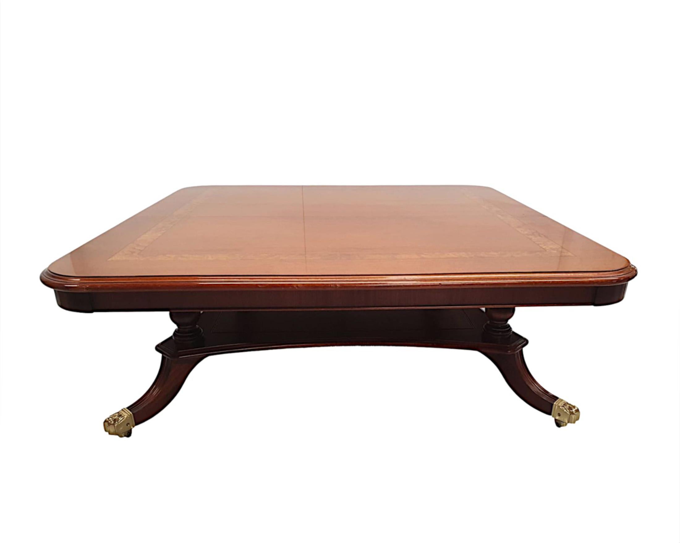 A fabulous hand made 20th century mahogany and walnut coffee table by Charles Barr, UK, finely carved and of fabulous quality with rich patination and grain. The well figured moulded and crossbanded top of square form raised above beautiful ring