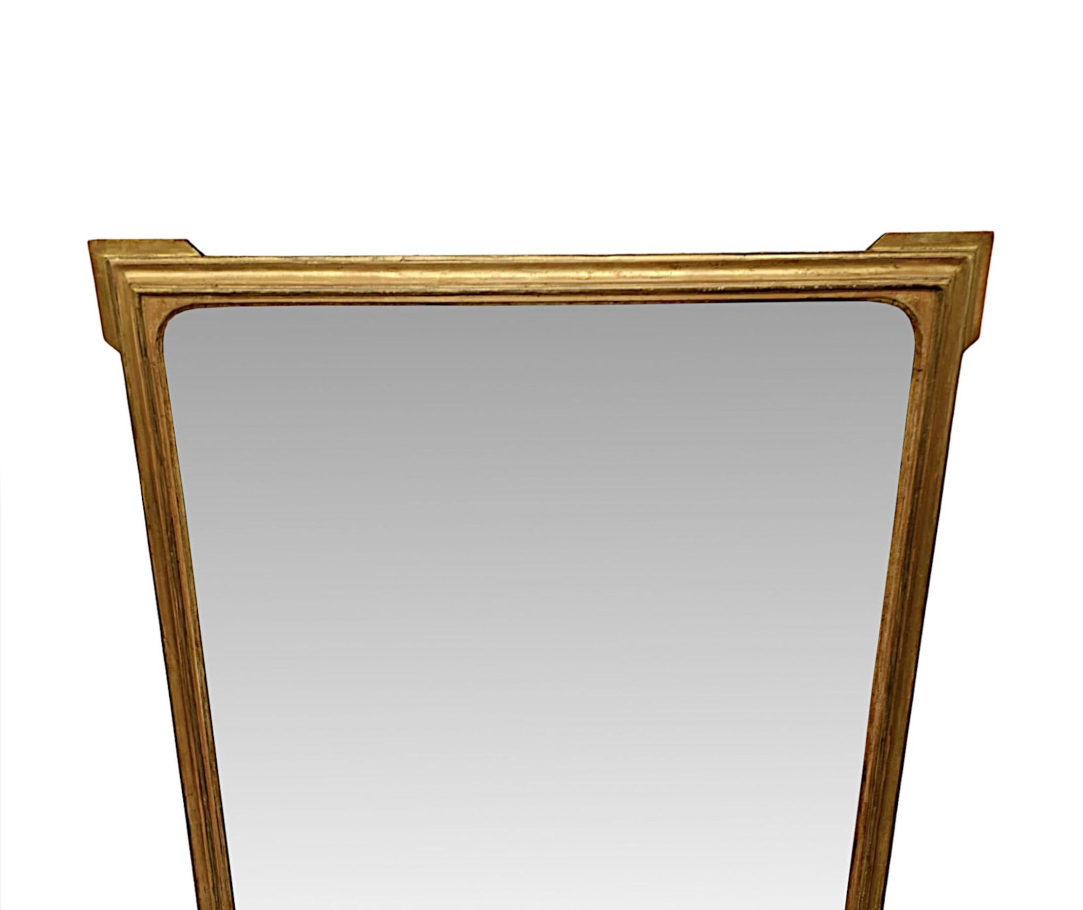 A fabulous 19th Century giltwood overmantel mirror of exceptional quality and grand proportions.  The  mirror glass plate of rectangular form is set within a finely hand carved and beautifully simple, moulded and fluted giltwood frame with shaped