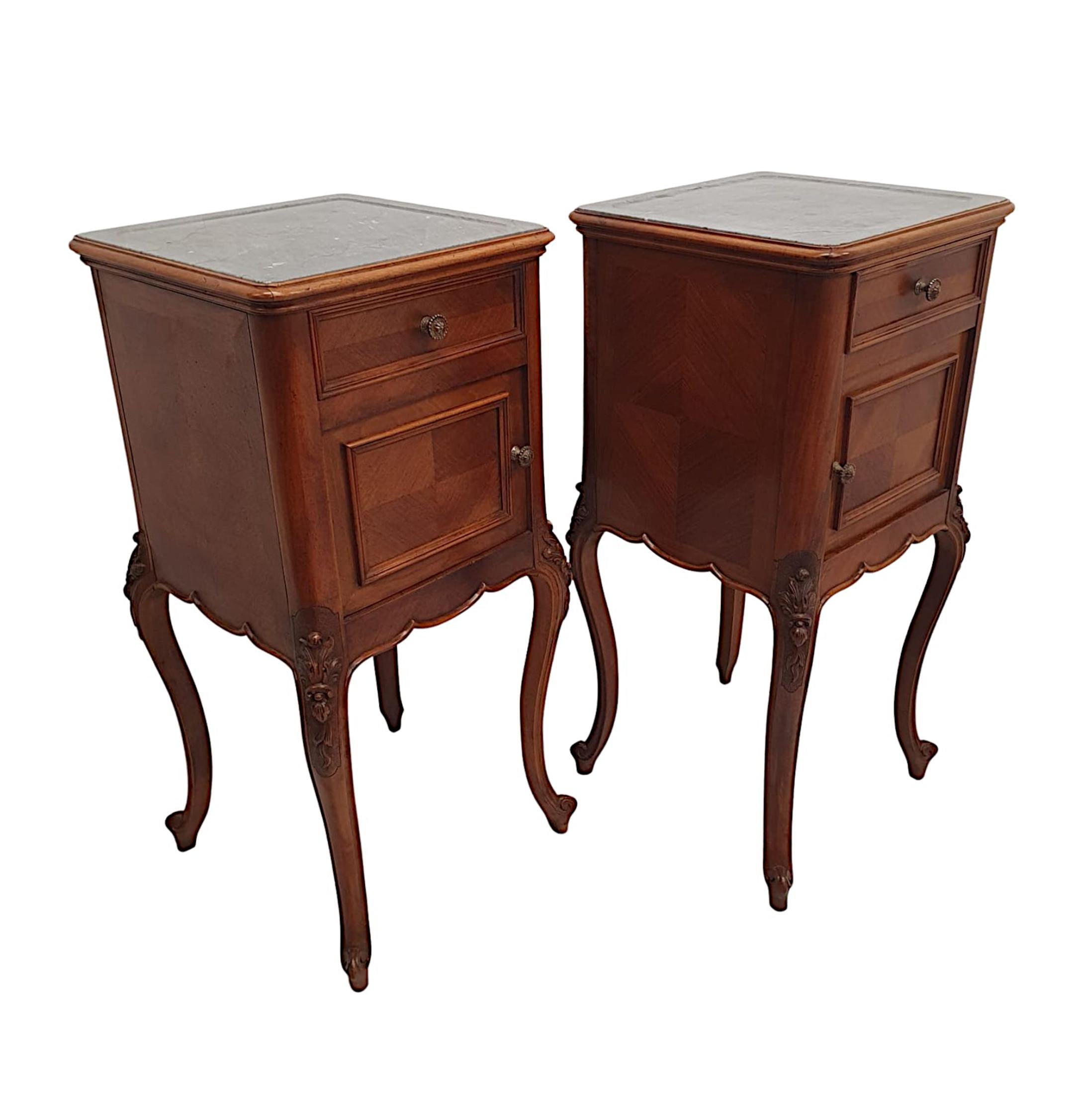 A fabulous pair of 19th Century marble top walnut and kingwood bedside tables, of superb quality and finely hand carved with rich patination and grain. The gorgeous, moulded grey marble top of square form is raised over single drawer above single