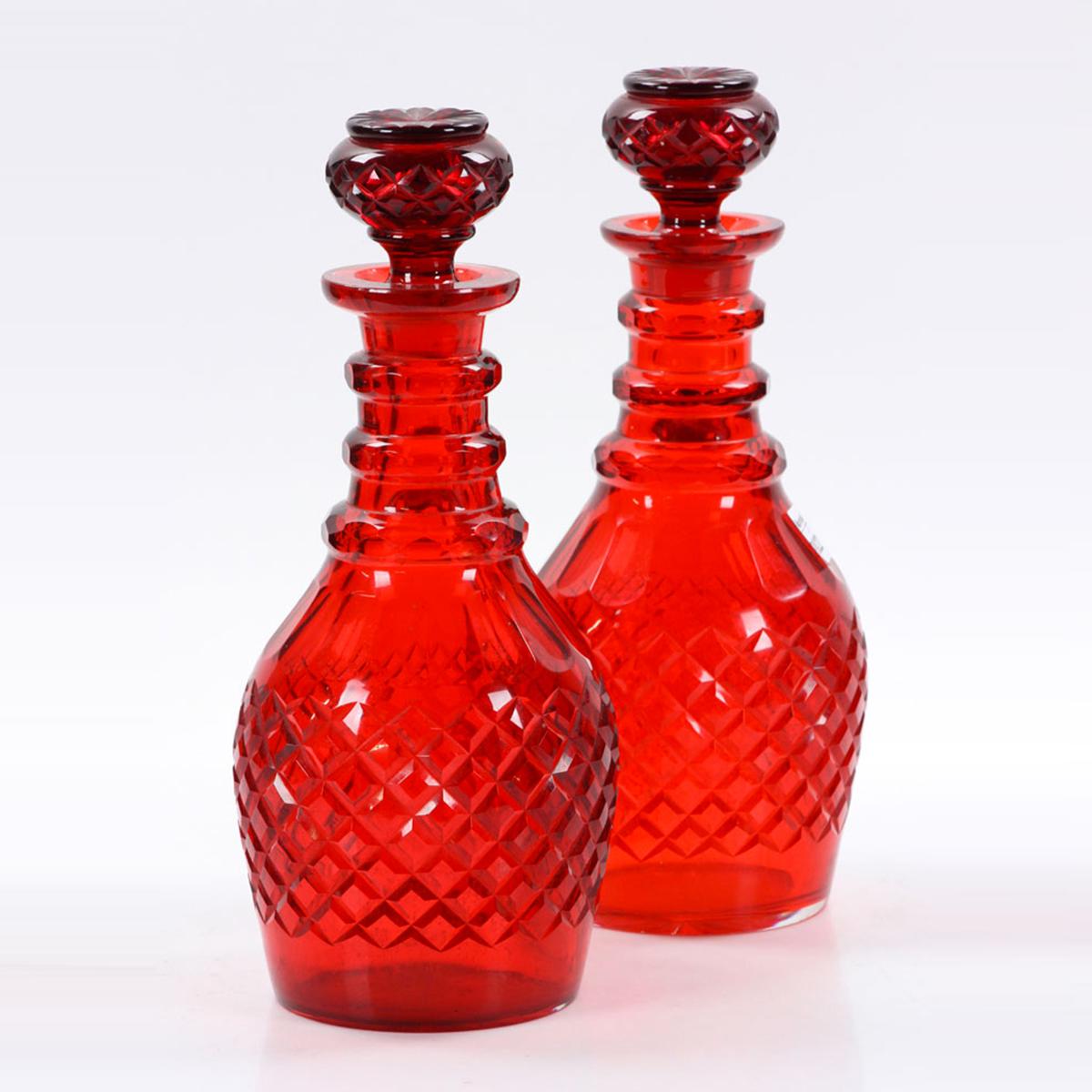 These large Bohemian decanters are an incredibly striking scarlet in person. Perfect for adorning open cabinetry, sprucing up your bar, or setting at the center of your next dinner party. 

Date: 19th century
Origin: Bohemia
Dimension: 12 1/2 in