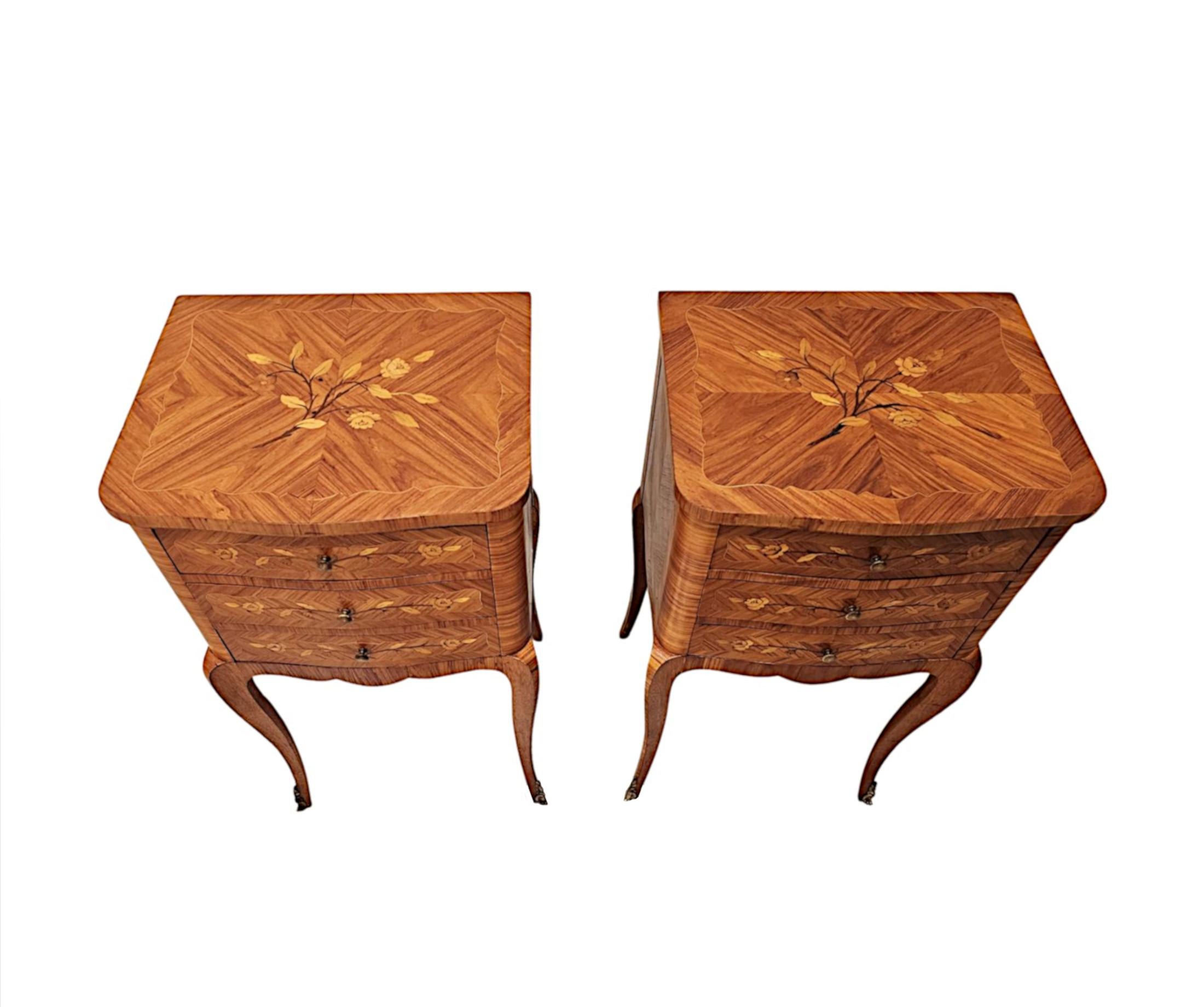A fabulous pair of early 20th Century richly patinated fruitwood bedside tables or chest of drawers of exceptional quality.  This stunning pair are finely hand carved, crossbanded with delicate line inlay and highly inlaid marquetry panel detail