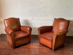 A Fabulous Pair of French Leather Club Chairs Chapeaux de Gendarme, Circa 1950's
