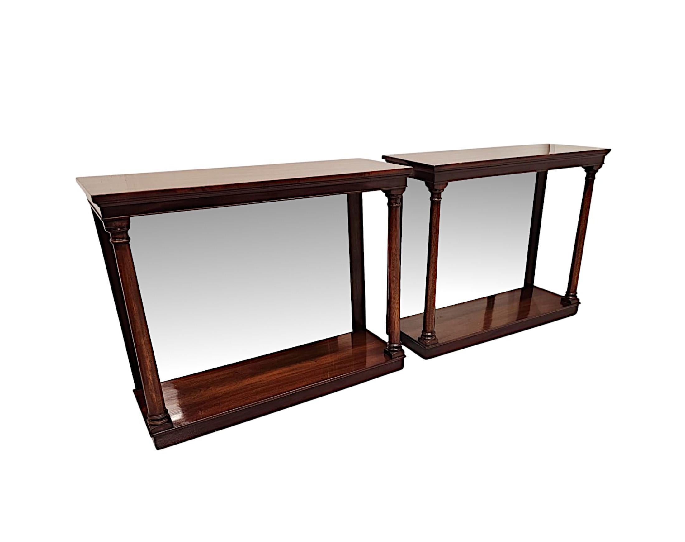 A fabulous pair of hand made mahogany 20th Century console tables in the Victorian style.  This lovely pair of tables are of exceptional quality, finely carved with beautifully rich patination and grain.  The well figured moulded top of rectangular