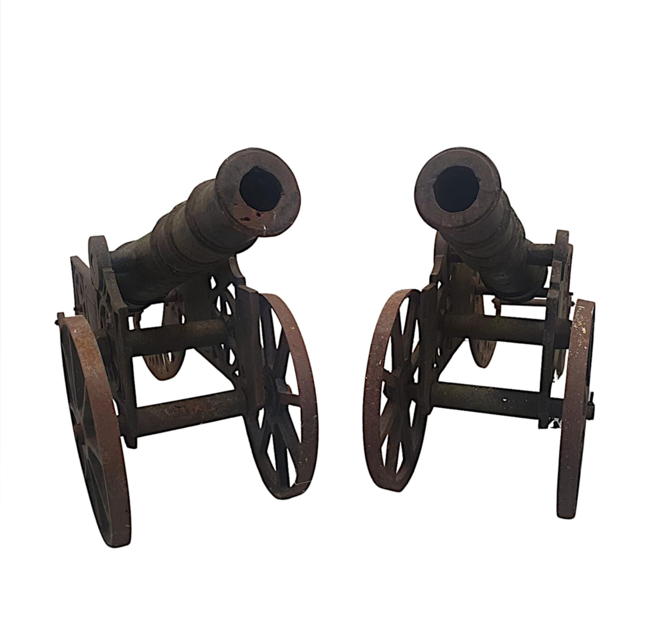 A fabulous pair of mid 20th Century cast iron garden cannons of large proportions and of exceptional quality with superb patination and colour. 

Price is per pair. 