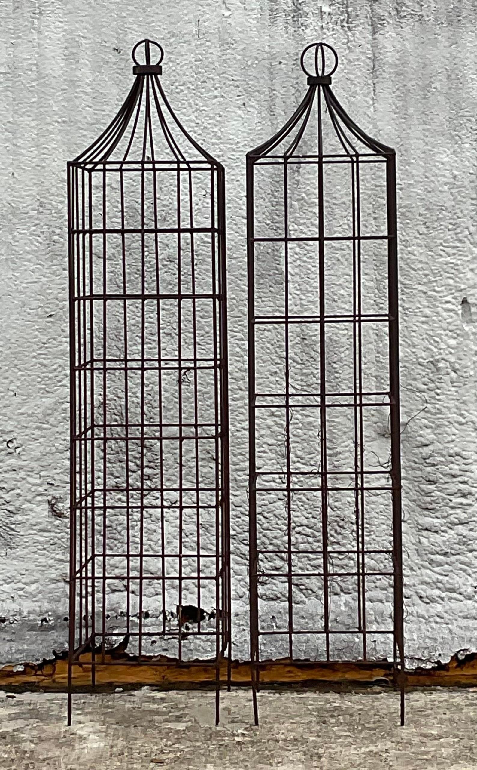 A fabulous pair of vintage Boho trellis topiaries. Beautiful wrought iron frame in a classic topiary design. Perfect in the ground or in your flowerpot. You decide! Acquired from a Palm Beach estate.