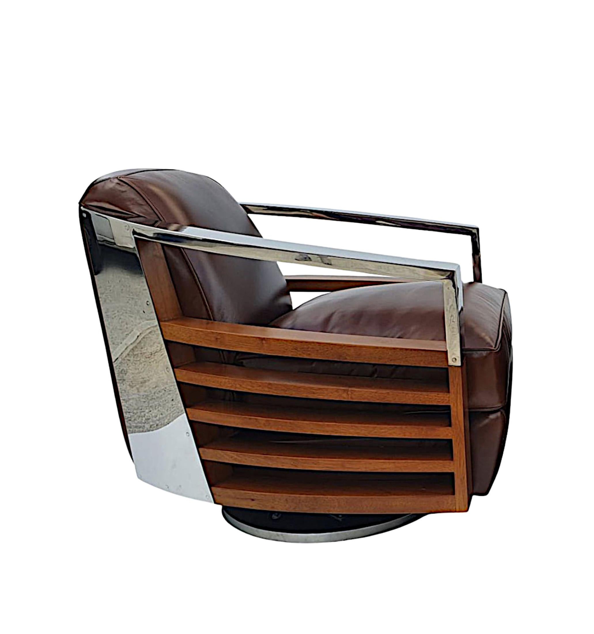 A fabulous quality contemporary revolving armchair in the Art Deco style. The cushioned back and seat beautifully upholstered in brown leather flanked with curved chrome arms, chrome panel detail to the back and gorgeous curved cherrywood pierced