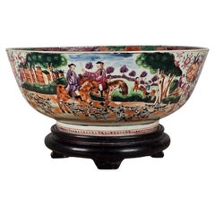 A Famille Rose 'hunt scene' Punch Bowl Qianlong Period