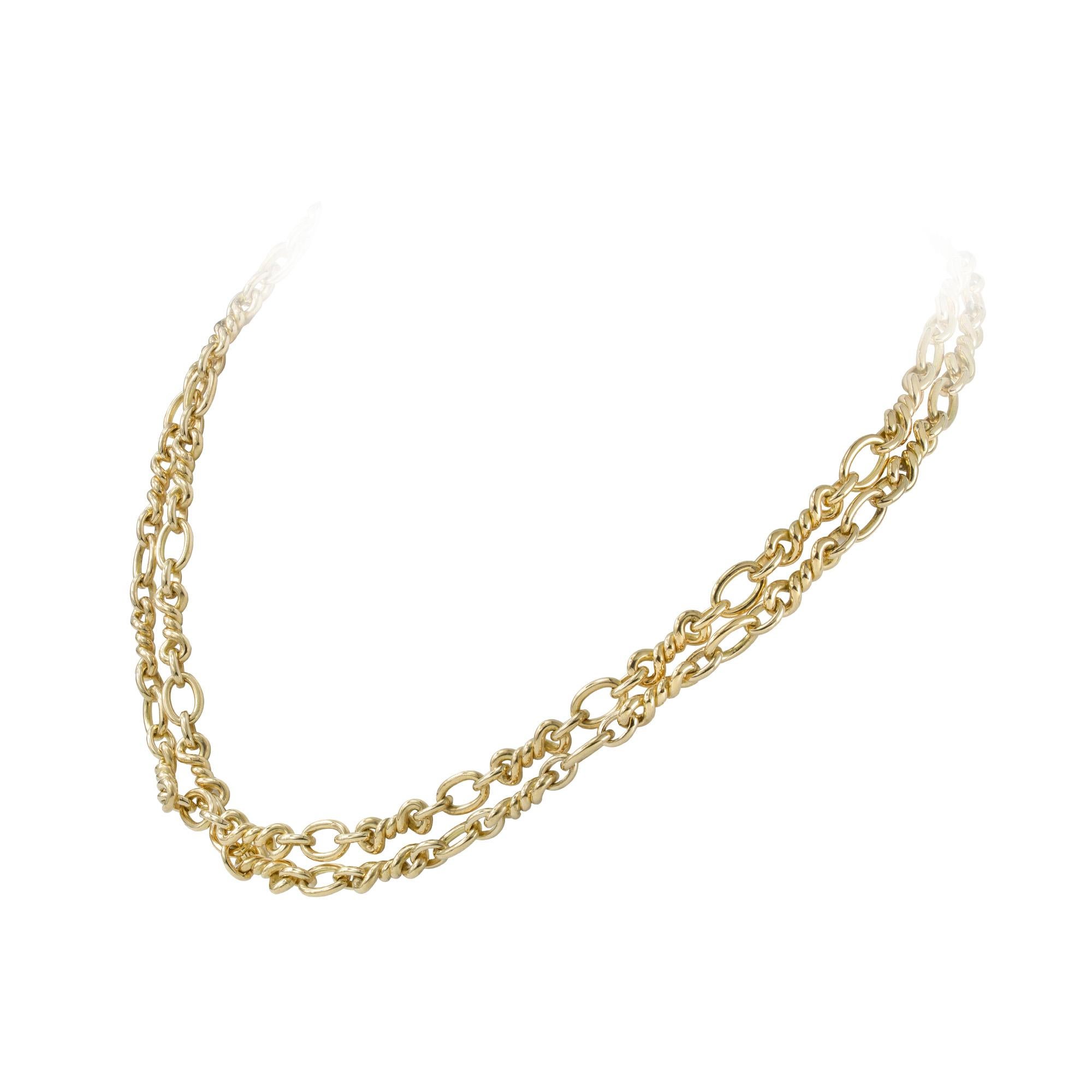 A fancy twist link gold chain, the long chain consisting of a twisted link to a three graduated belcher link pattern, hallmarked 18ct gold, London 1976, measuring approximately 86cm in length, gross weight 80.3 grams.

This chain is in excellent