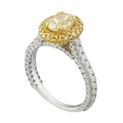A fancy yellow colour diamond ring