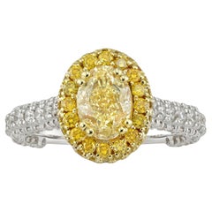 A fancy yellow colour diamond ring