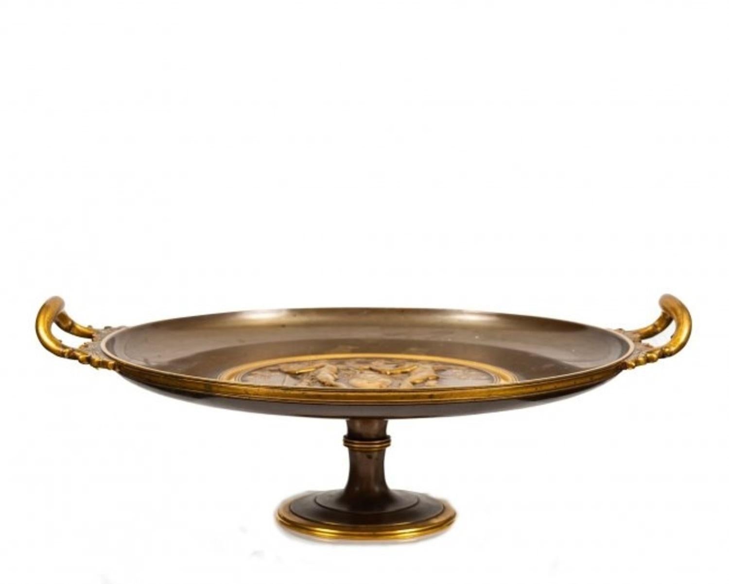 A fantastic Ferdinand Levillain Tazza (1837-1905),
Paris, circa 1890.
In the celebrated neo-Grec fasion, the tazza in gilt and patinated bronze, signed F. Levillain.
Height 9 in.;
Diameter 16 in.
22.8 cm; 40.6 cm
catalogue note:
The source of