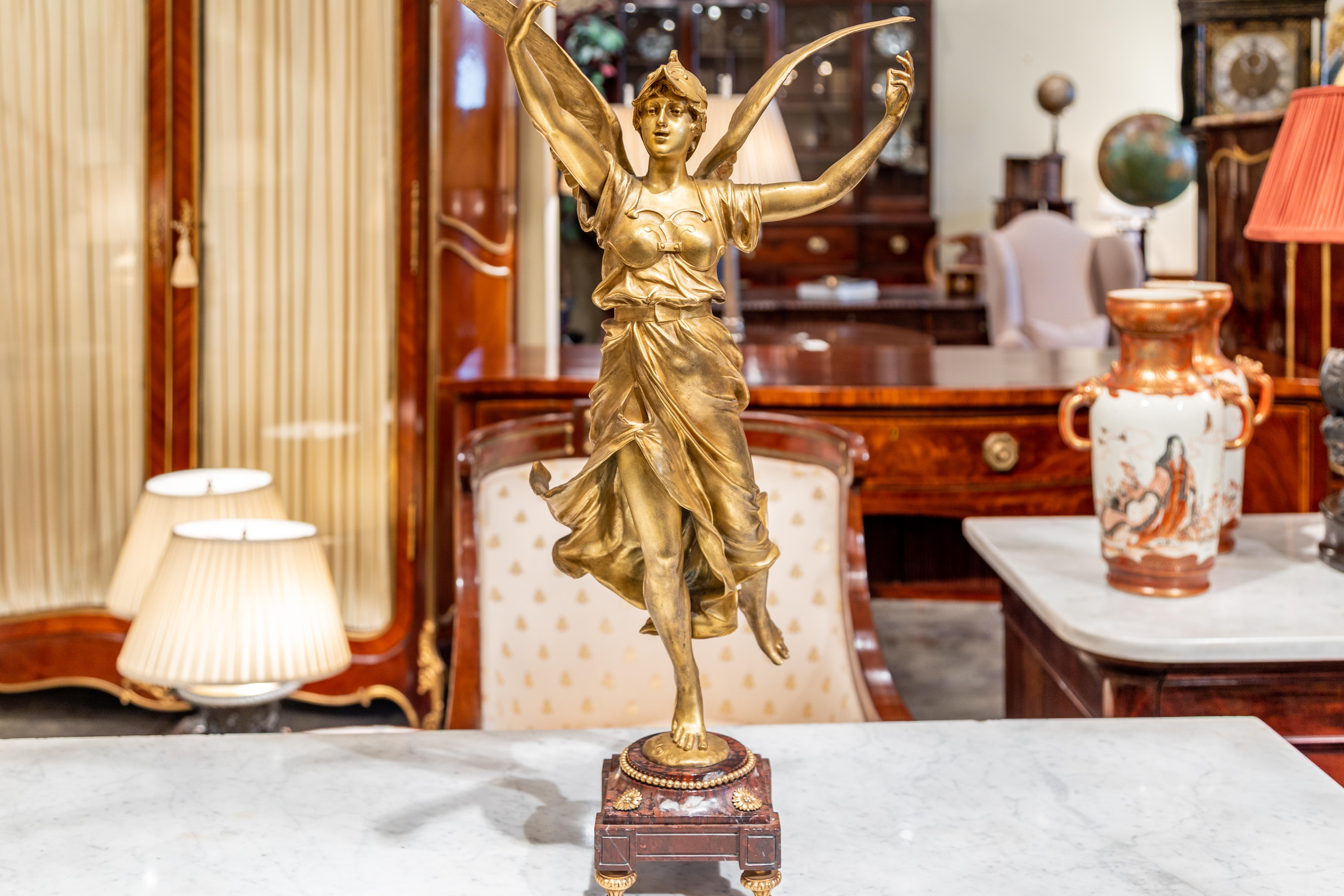 A fantastic 19th century French gilt bronze large bronze by Eugene Marioton . The bronze is on a Rouge marble and gilt bronze base.
