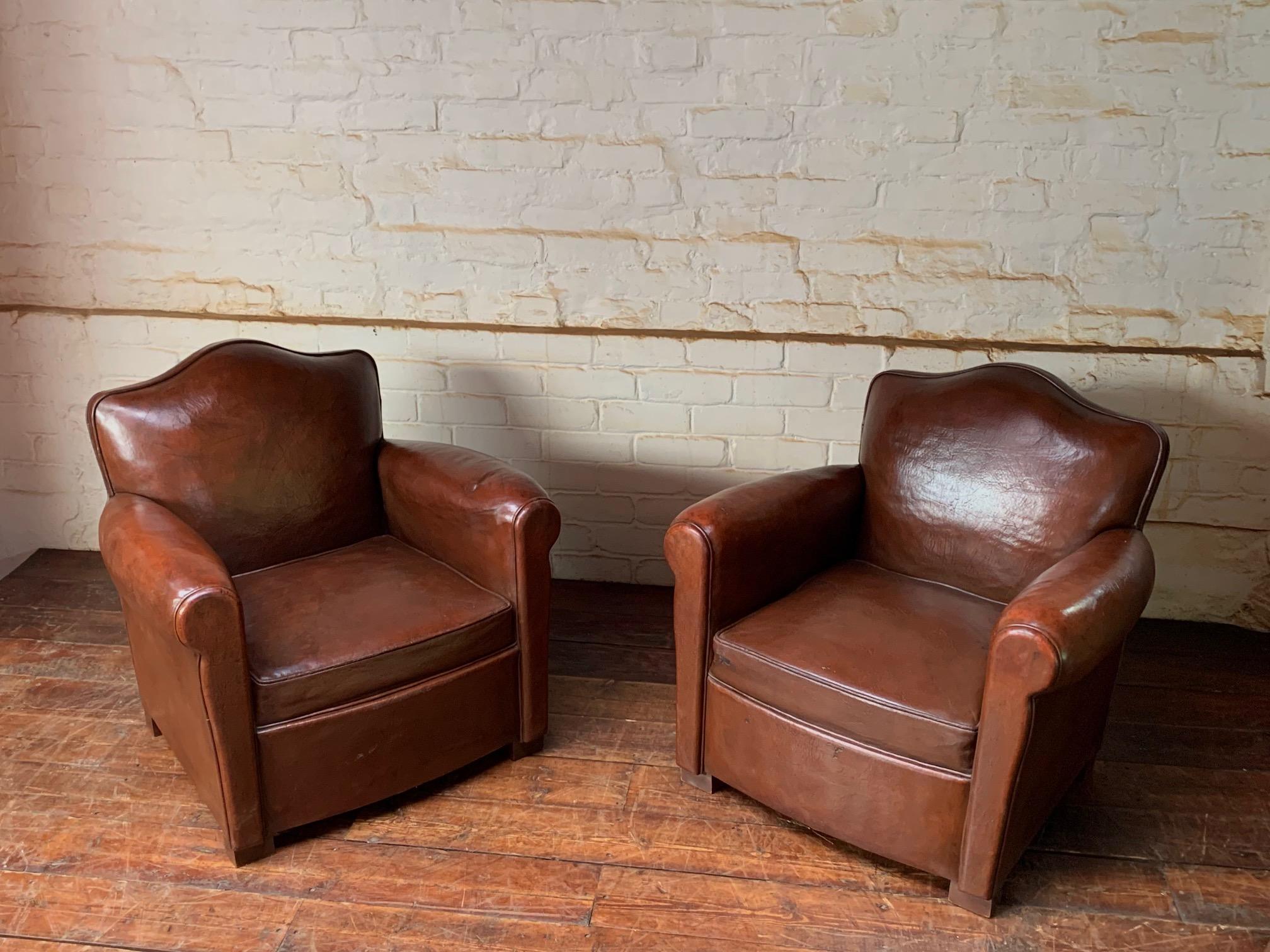 A Fantastic Pair of French leather Club chairs Circa Chapeau de Gendarme models1950’s

This is a great pair of compact, original French leather club chairs. The lovely, full grain thick leather is in wonderful, original condition. The colour is best