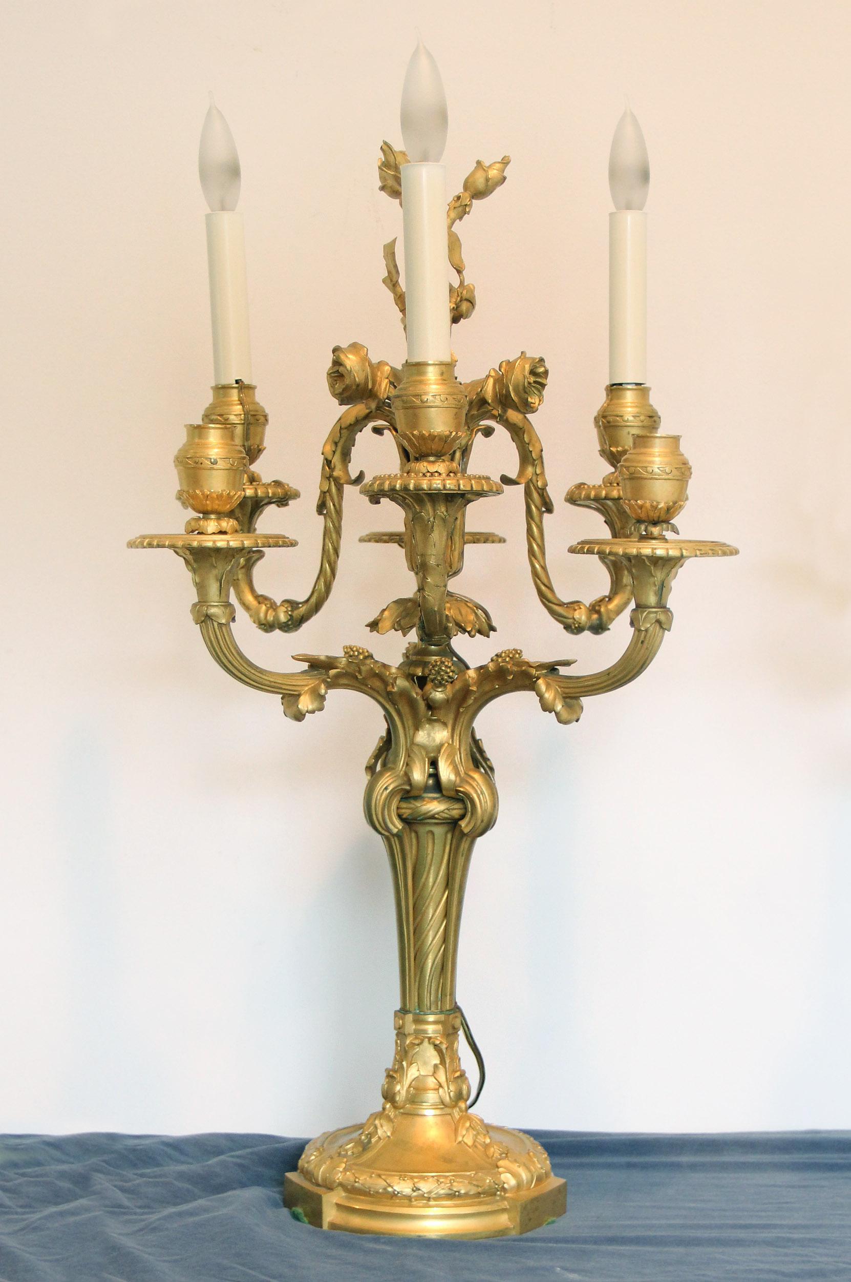 A fantastic quality pair of late 19th century gilt bronze six-arm candelabra

Each with a very fine designed upper body with roses and berries, the lower part as a spiral on a round base, six tiered scrolling and spiraling branches with a central