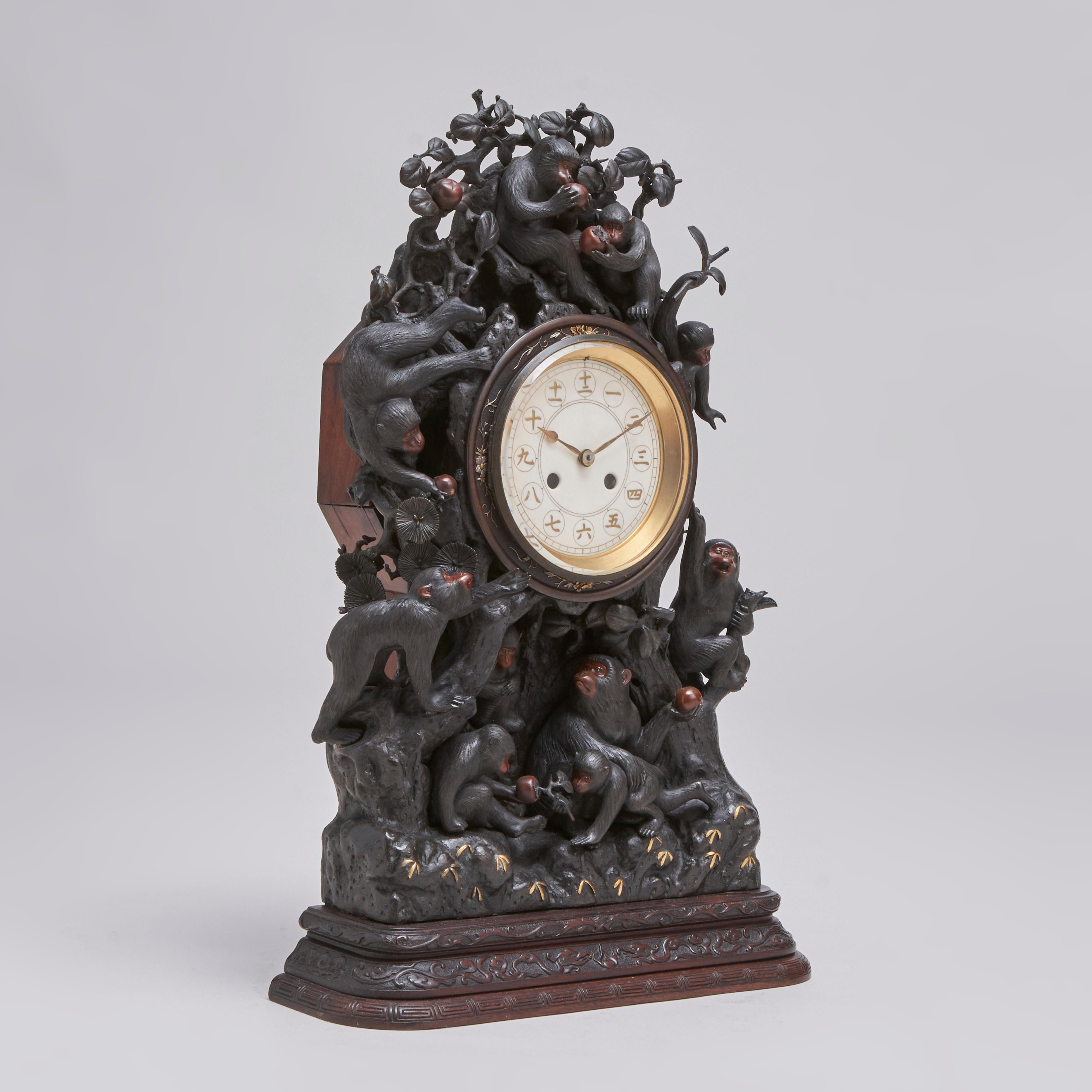 From our collection of antique Japanese metalware, this fascinating Meiji-era (1868-1912) large, Bronze clock in the form of a troop of playful monkeys clambering around a Persimmon tree.

The body of the clock is moulded in the form of the tree