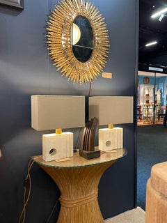 A faux bamboo demilune console table in a wheat sheaf shape, with glass top.