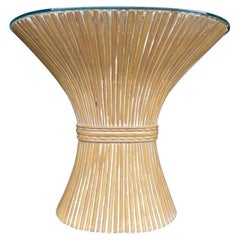 A faux bamboo demilune console table in a wheat sheaf shape, with glass top.
