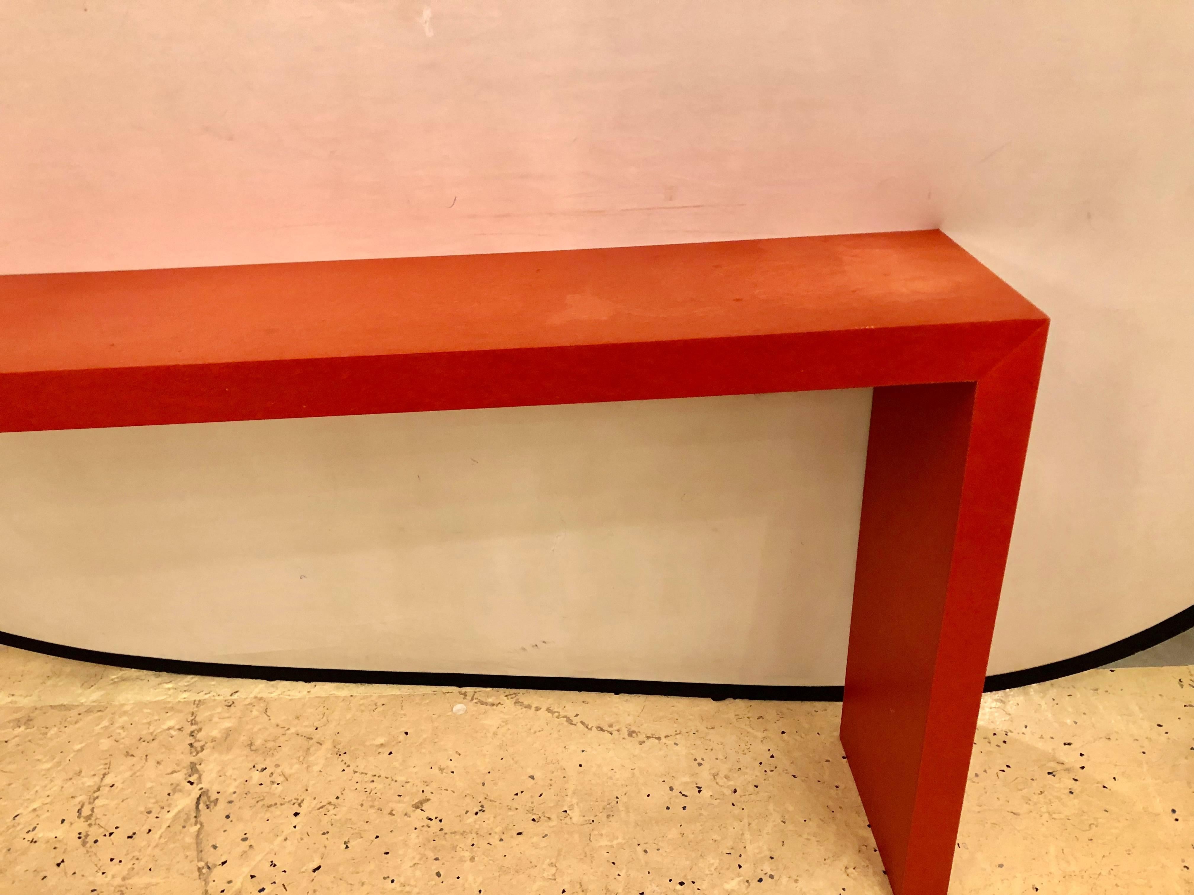 A faux paint decorated pier console or wooden bench in dark orange paint. This alter style table or bench is finely paint decorated with sleek and stylish lines.