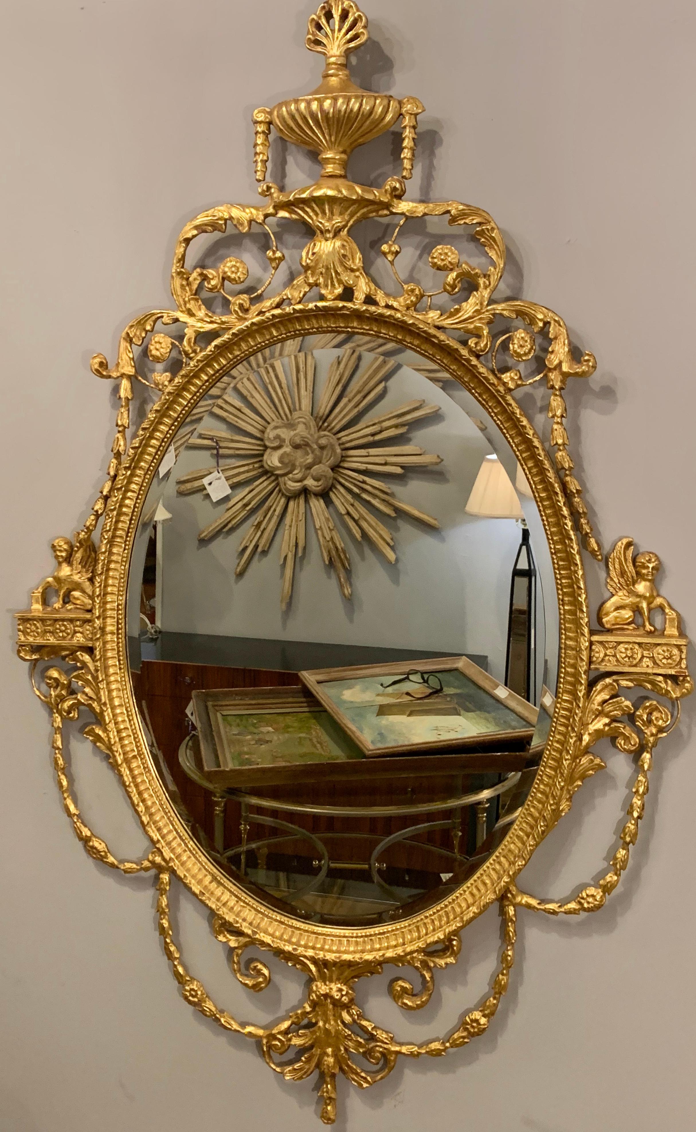 A Federal style Friedman Bros gilt wooden wall or console mirror having winged griffins on each side.

1SXX/1XXX.