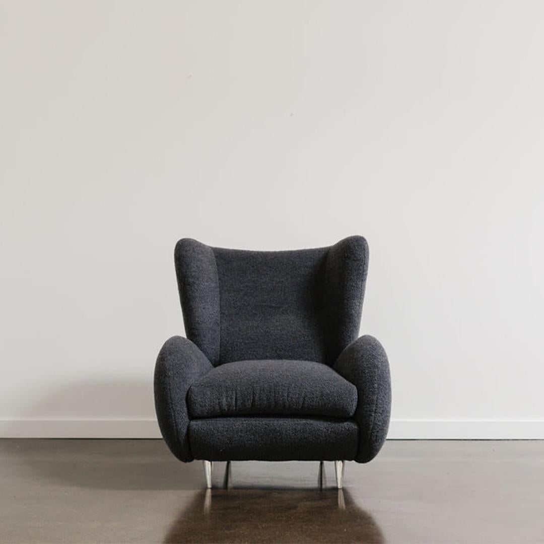 A rare Vladimir Kagan for American Leather ‘Fiftyish’ wingback chair based on his winged barrel-form designs from the 1950’s with Kagan-Dreyfuss. This perfect balance of midcentury modern style and postmodern appeal, the chair has been reupholstered
