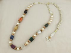 A fine 18K gold Navratana carved gold polki necklace string for indian weddings