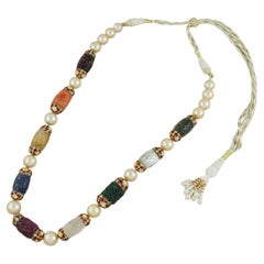 A fine 18K gold Navratana carved gold polki necklace string for indian weddings