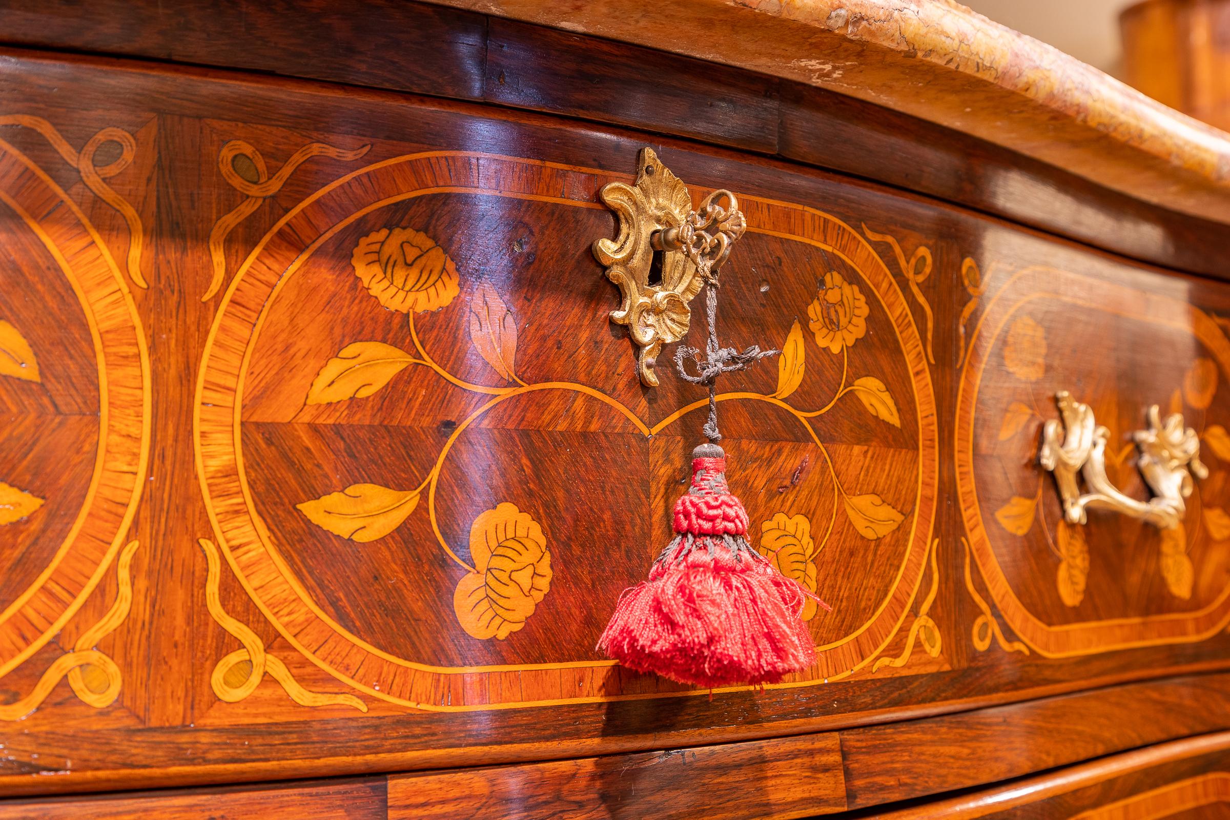 A very fine late 18th century French Louis XV mahogany and marquetry inlayed marble top commode with gilt bronze mounts. Original marble top with tulipwood and satinwood inlayed vines leaves and birds. Provenance Christies label from a Monaco sale.