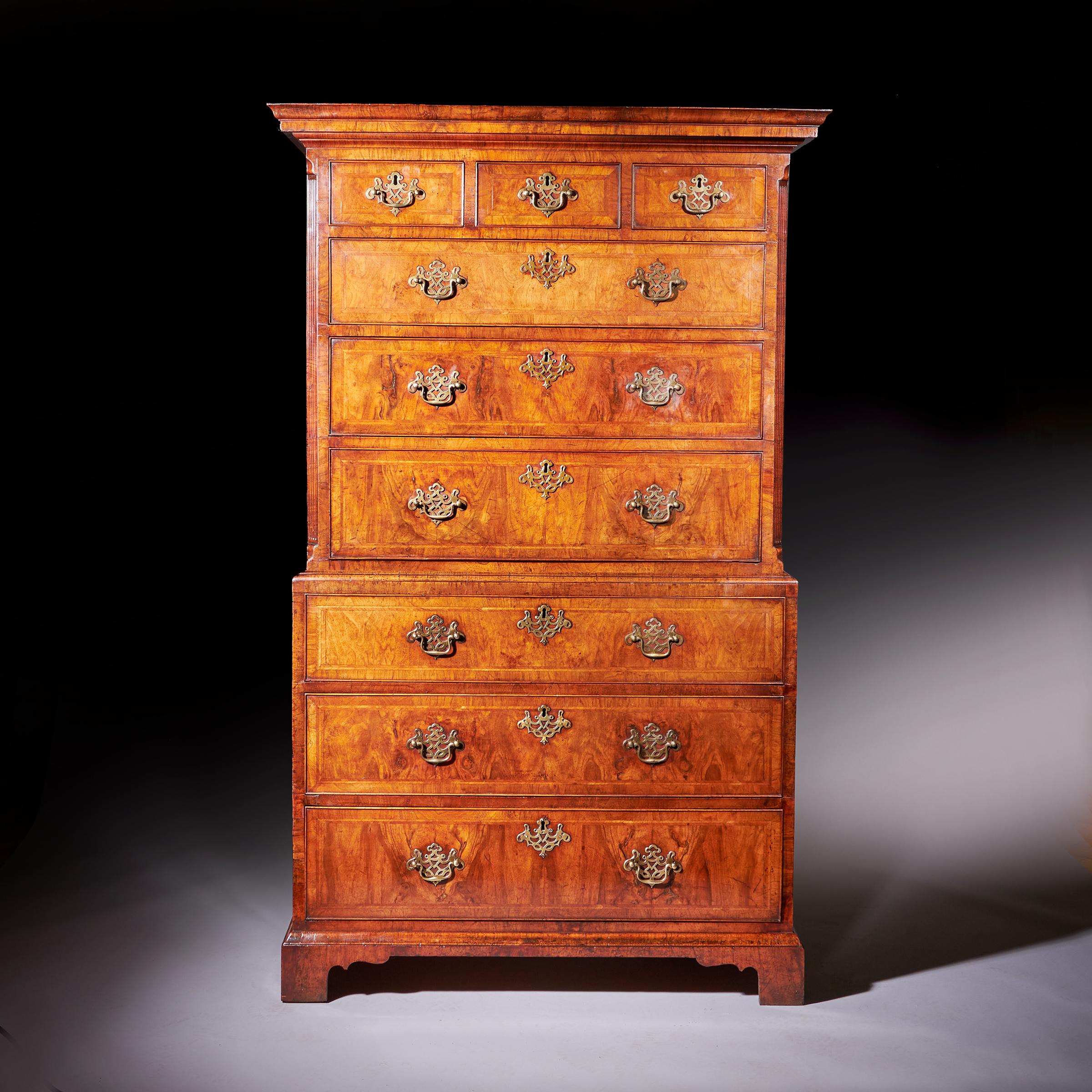A Fine 18th Century George II Figured Walnut Chest on Chest or Tallboy, Circa 1740. England. 

In two parts divided by a cross grain moulding the reeded upper section consists of a complex cross-grain cornice over three short and three long