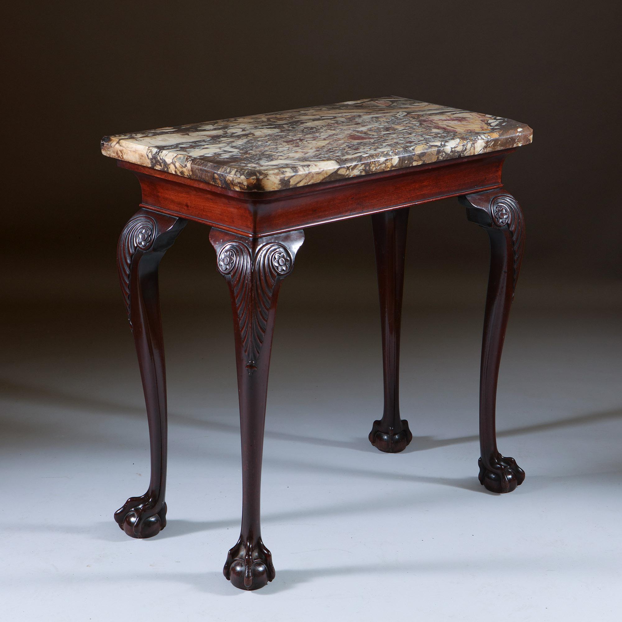 A Fine George II Mahogany Marble Topped Console Table, Circa 1750. Ireland

The original thick cut and chamfered patinated Breccia Viola marble top sits above the mahogany concave and moulded frieze, raised on four well drawn accentuated finely