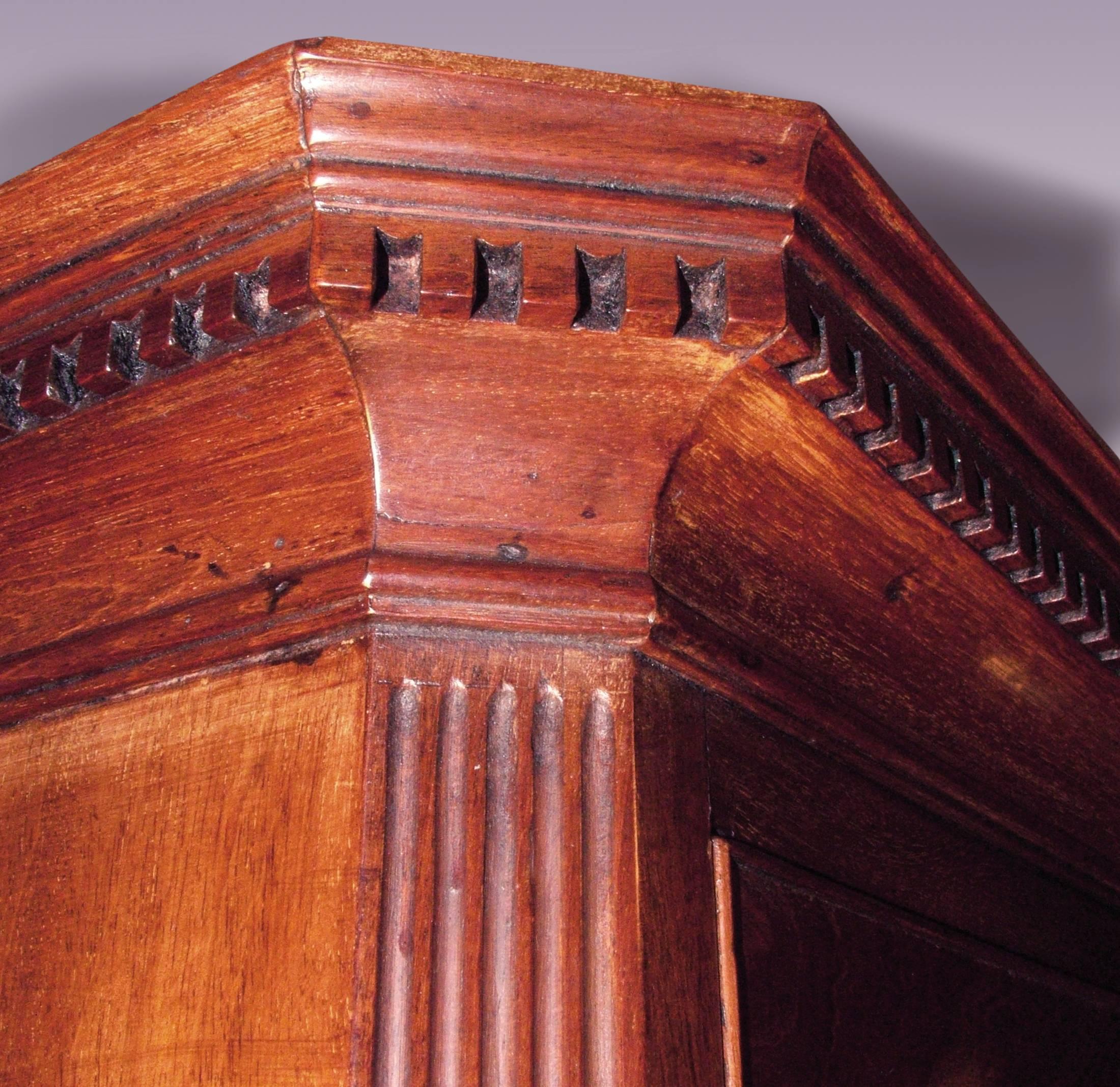 A fine quality mid-18th century well-figured mahogany tallboy, having canted cornered dentil moulded cornice above 2 short and 6 long cockbeaded drawers retaining original gilt-brass Rococo handles. The Tallboy with stop-fluted canted corners