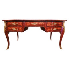 A fine 18th century Regence kingwood and gilt bronze mounted Louis XV desk