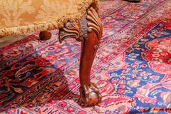 A fine 19th c  English  walnut wingchair. Eagles heads with ball & claw feet