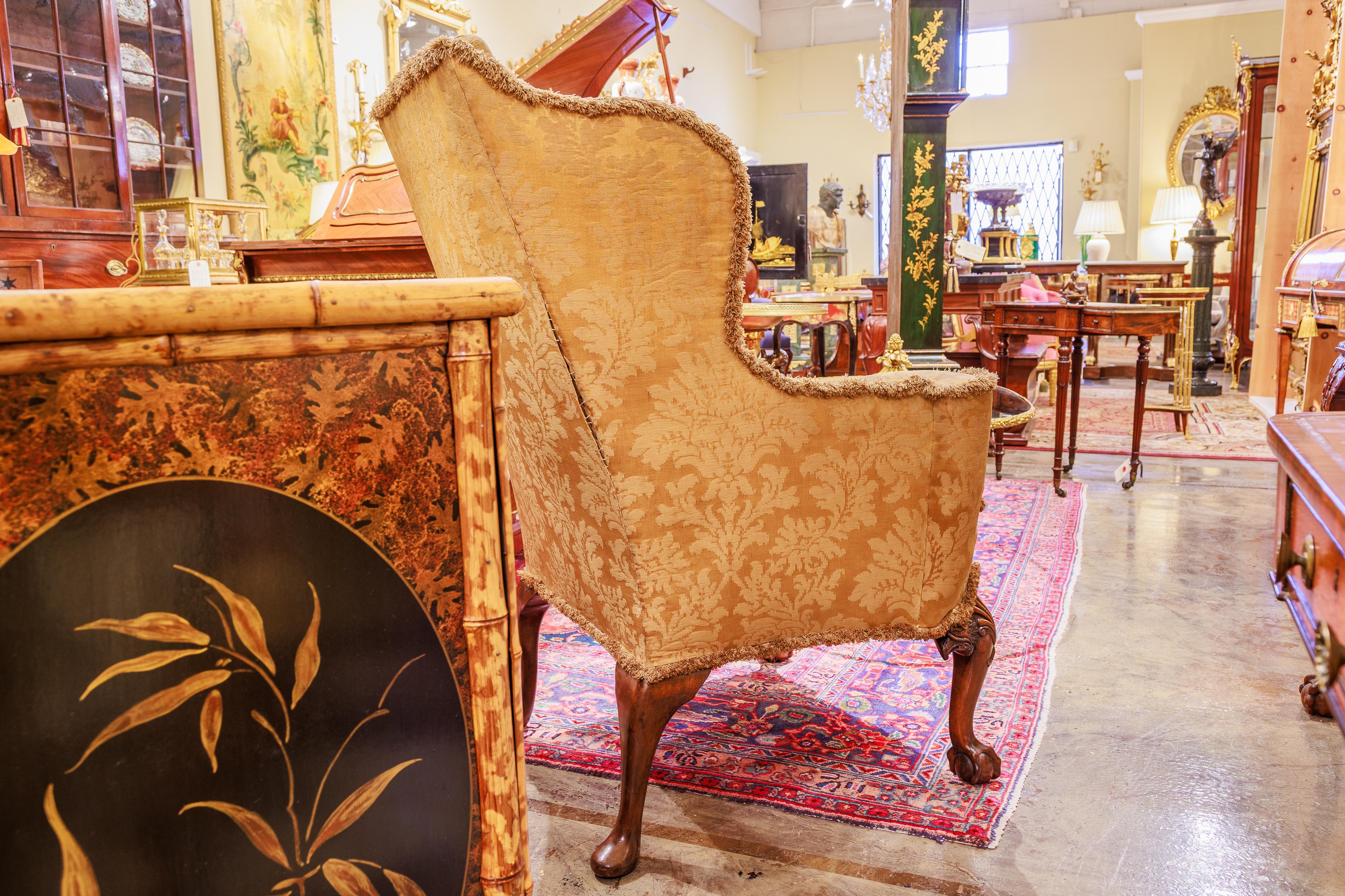 Chippendale A fine 19th c  English  walnut wingchair. Eagles heads with ball & claw feet For Sale