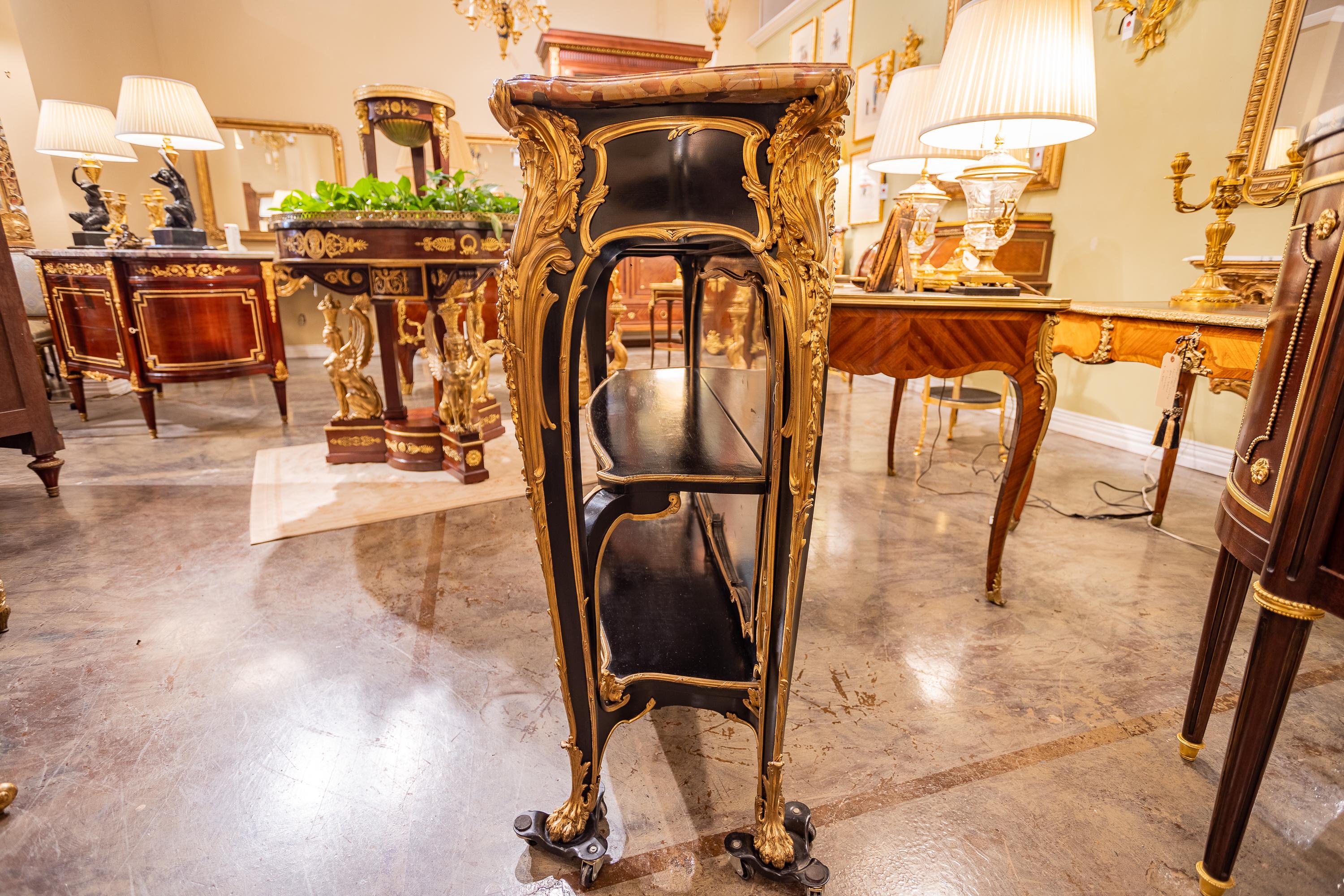 A fine 19th century French Louis XV ebonized and gilt bronze mounted console. Single drawer. Breche d Alep marble top original. Finest quality gilt bronze. Signed Zweiner.