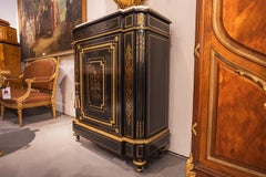 A fine 19th c French ebonized marble top cabinet, gilt bronze mounts by Diehl