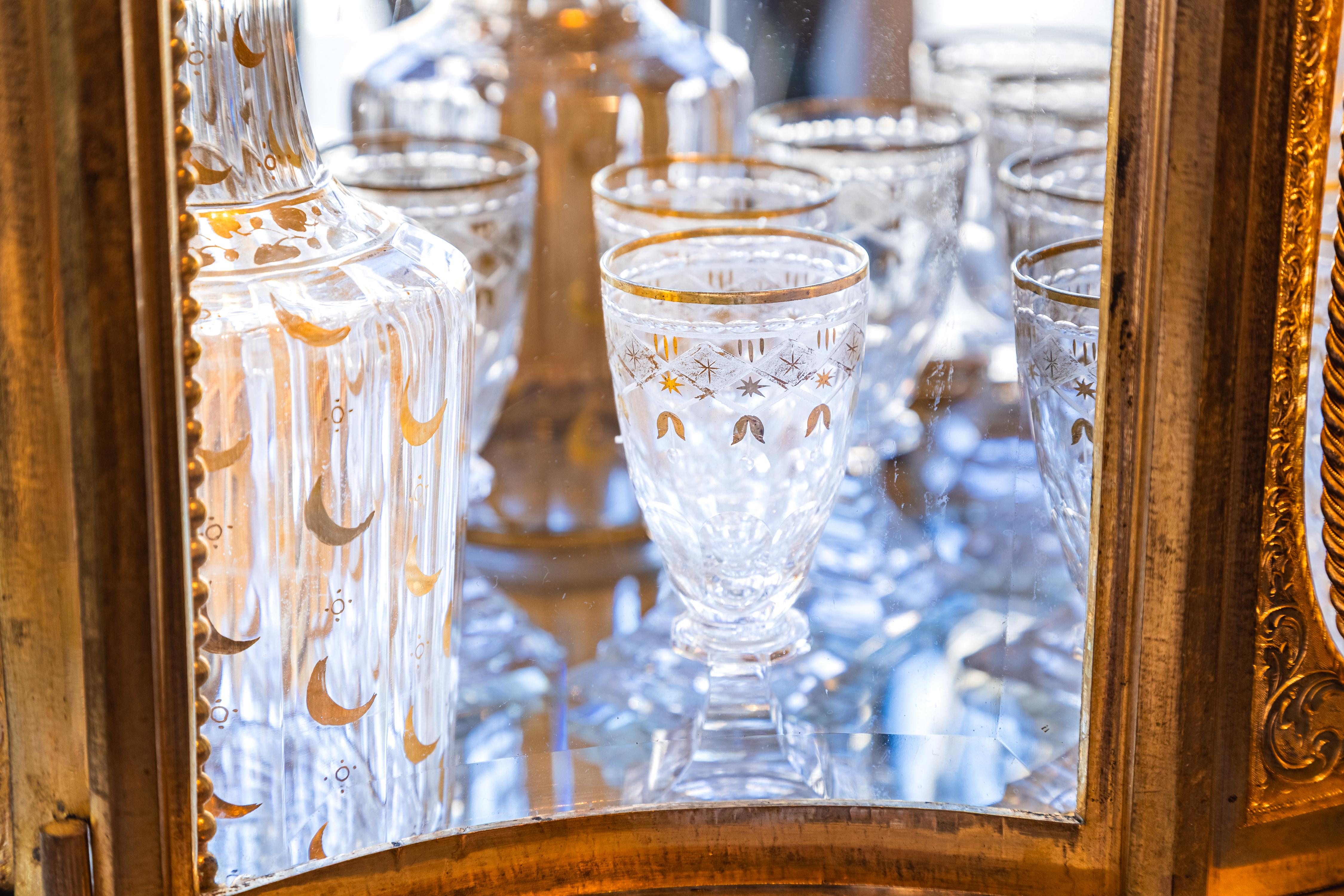 A  fine 19th c French Liquor set . Gilt bronze and glass with crystal decanters In Good Condition For Sale In Dallas, TX