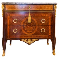 A fine 19th c French Louis XVI commode with gilt bronze mounts. P. Sormani