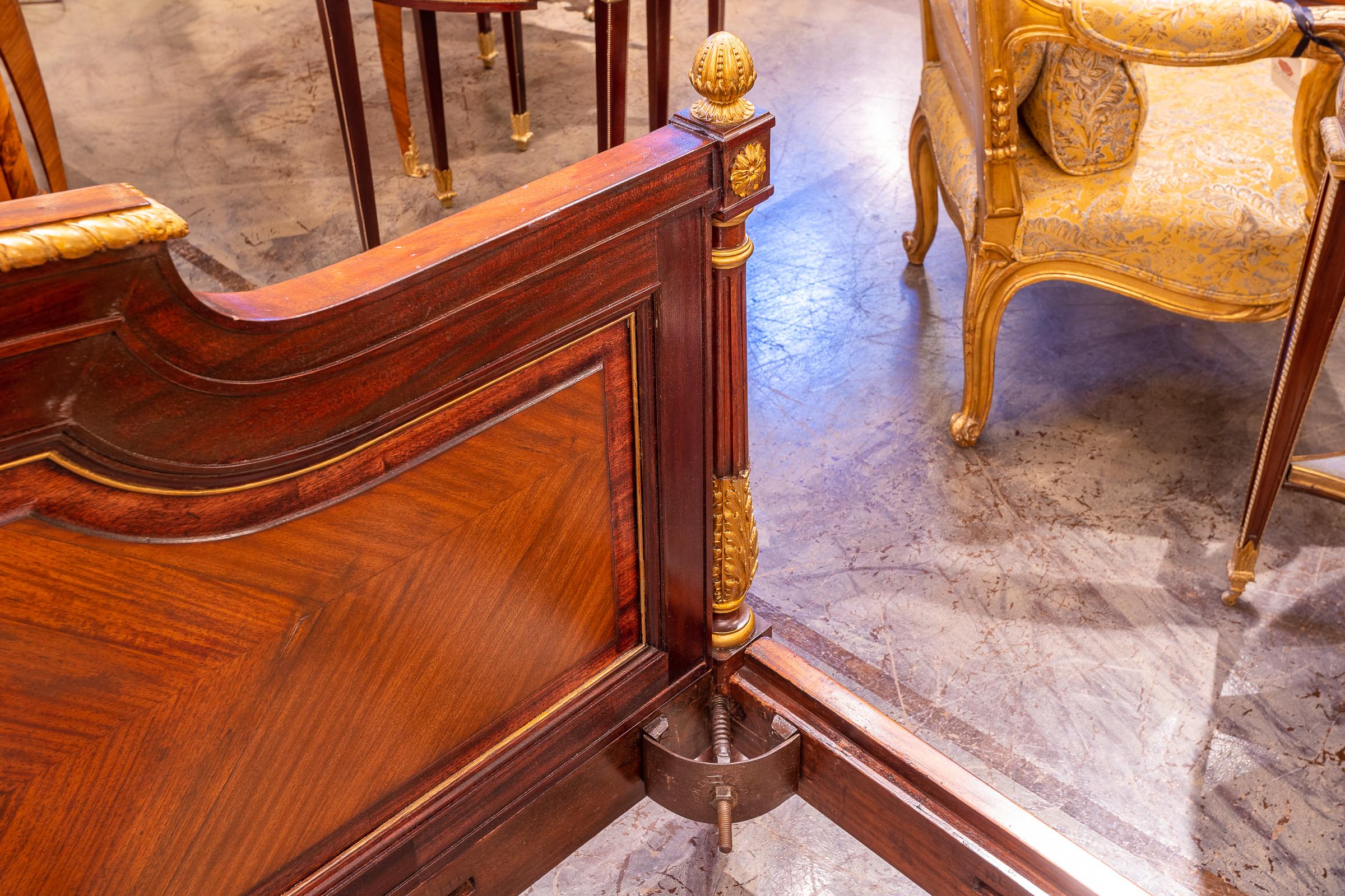A fine 19th c French Louis XVI kingwood and rosewood parcel gilt carved King bed 1