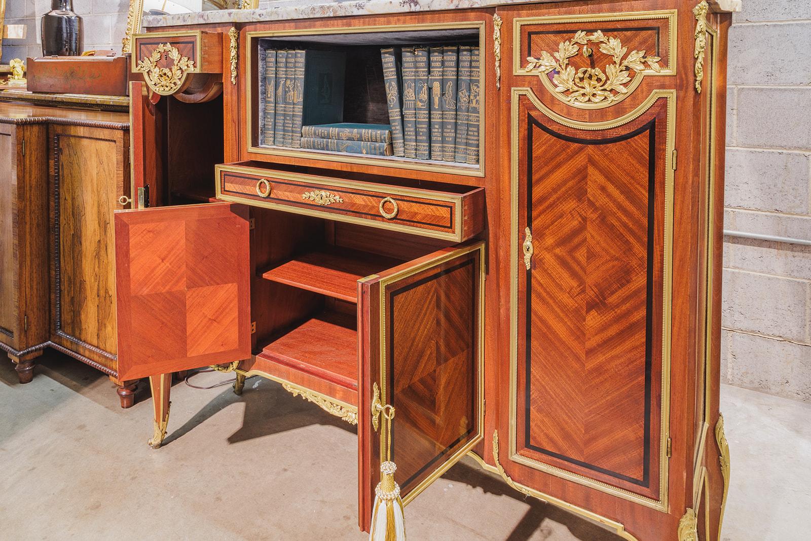 A very fine late 19th century French Louis XVI kingwood parquetry inlayed bookcase cabinet . Fine gilt bronze mounts and detail . Original Breche Violette marble top. 