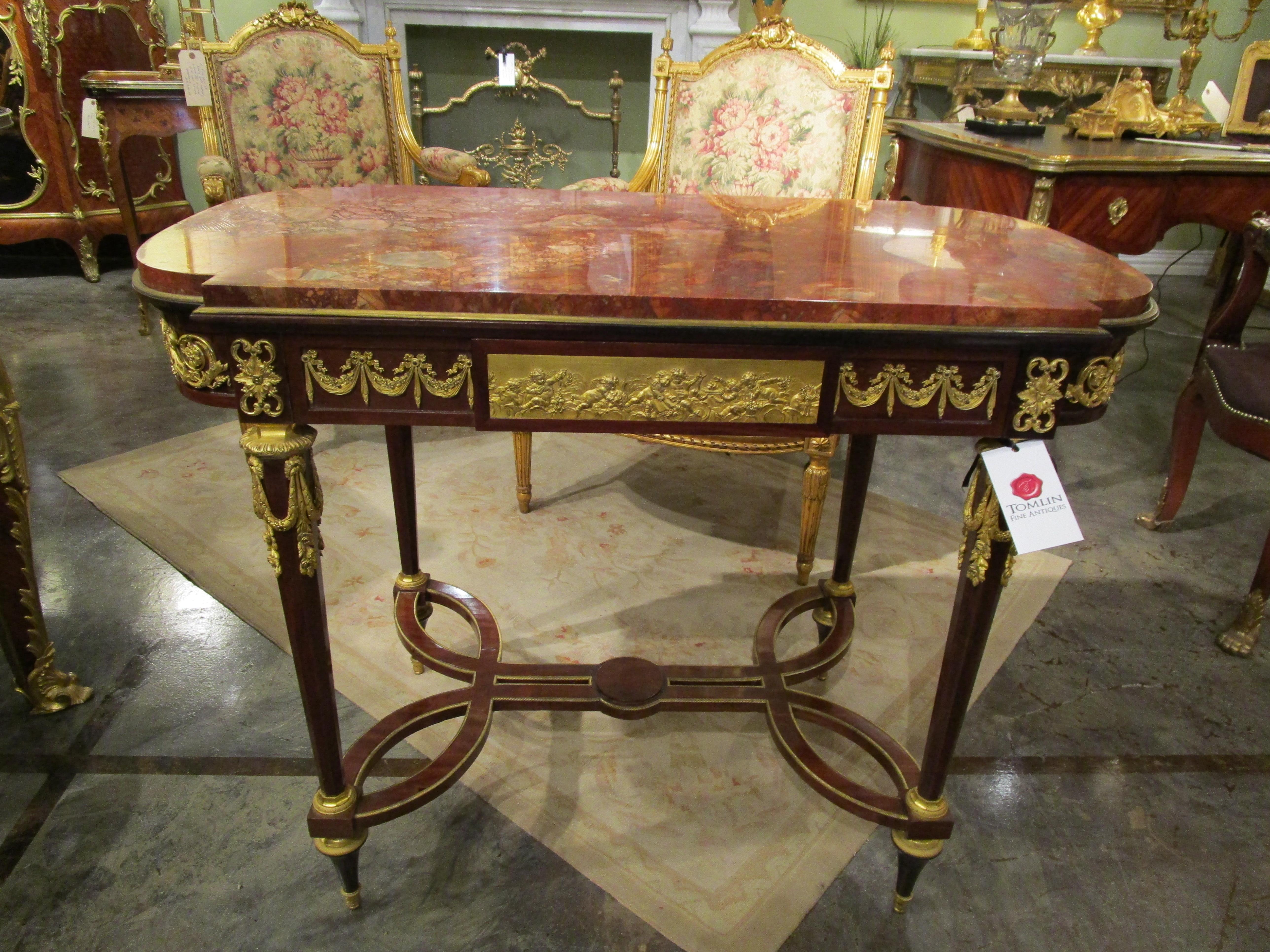 A fine 19th c French Louis XVI mahogany and gilt bronze mounted centertable 5