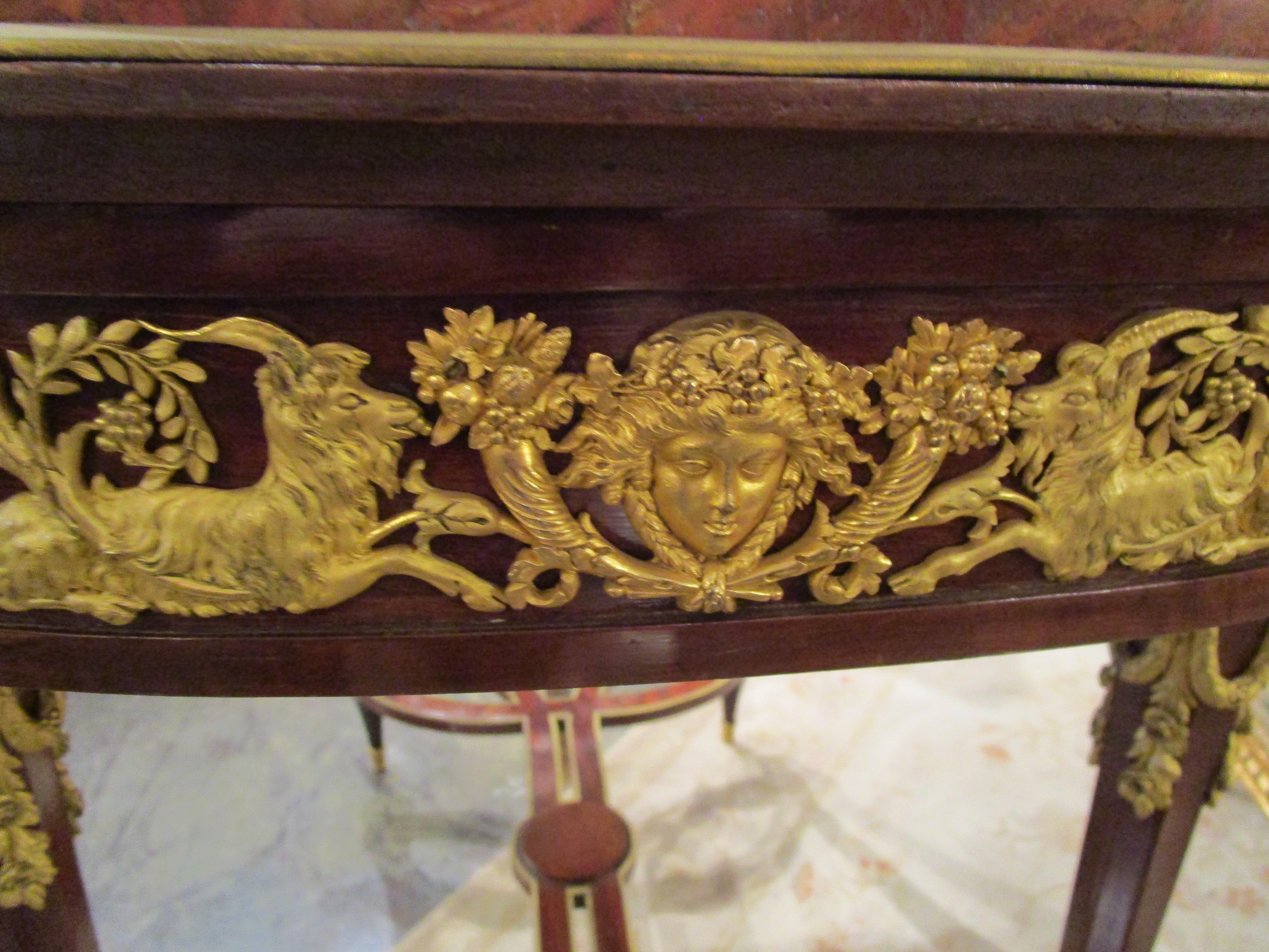 A fine 19th c French Louis XVI mahogany and gilt bronze mounted centertable 1