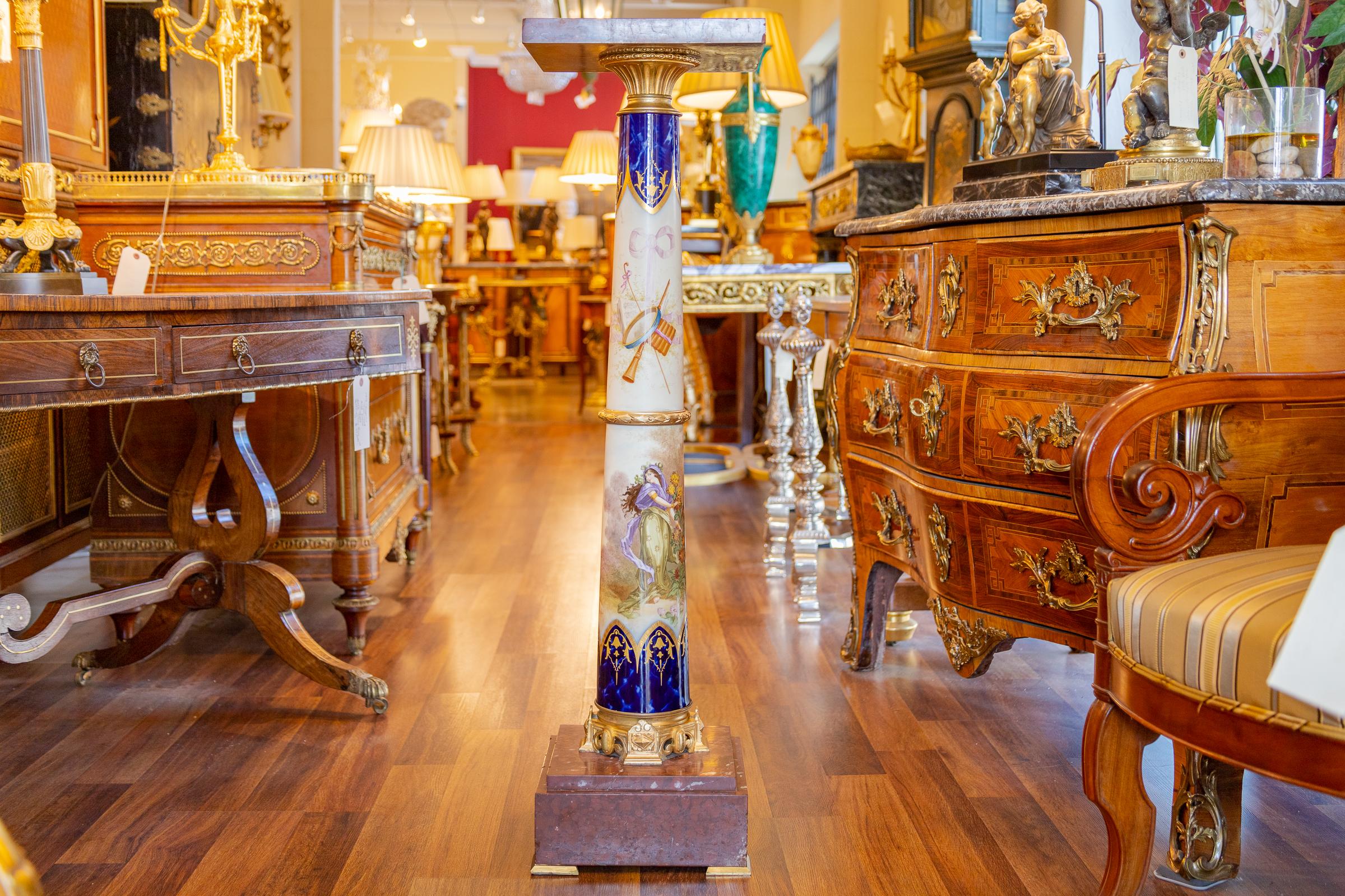 A fine 19th century French Sevre's porcelain hand painted pedestal with gilt bronze mounts and a rouge marble top and base.