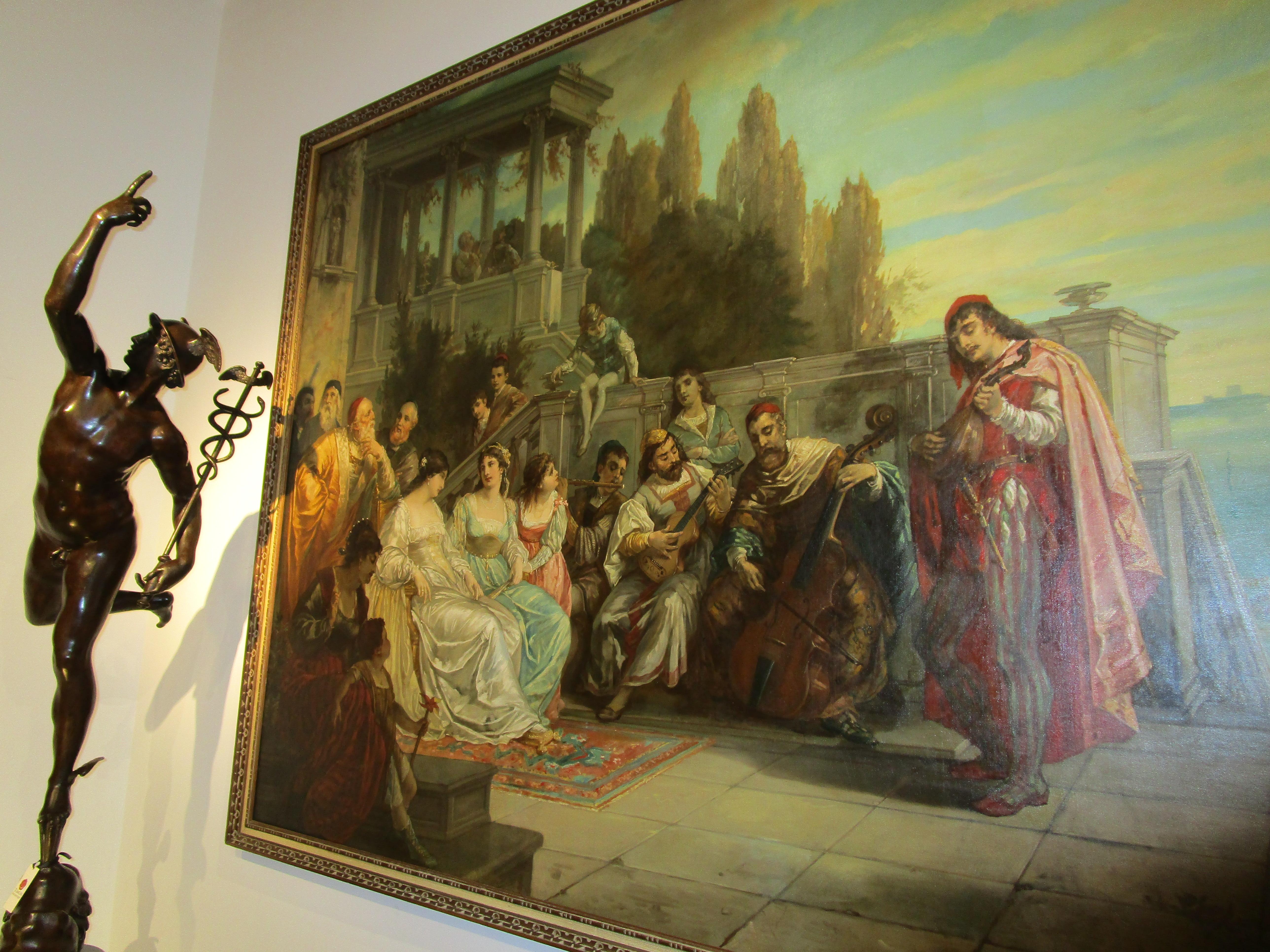 A  un pregiato e storico olio su tela di August Wolf. Intitolato Festival Veneziano . Questo grande olio su tela fu commissionato dal conte Adolf Friedrich Graf von Schack, un collezionista di opere di antichi maestri italiani e fiamminghi. Von