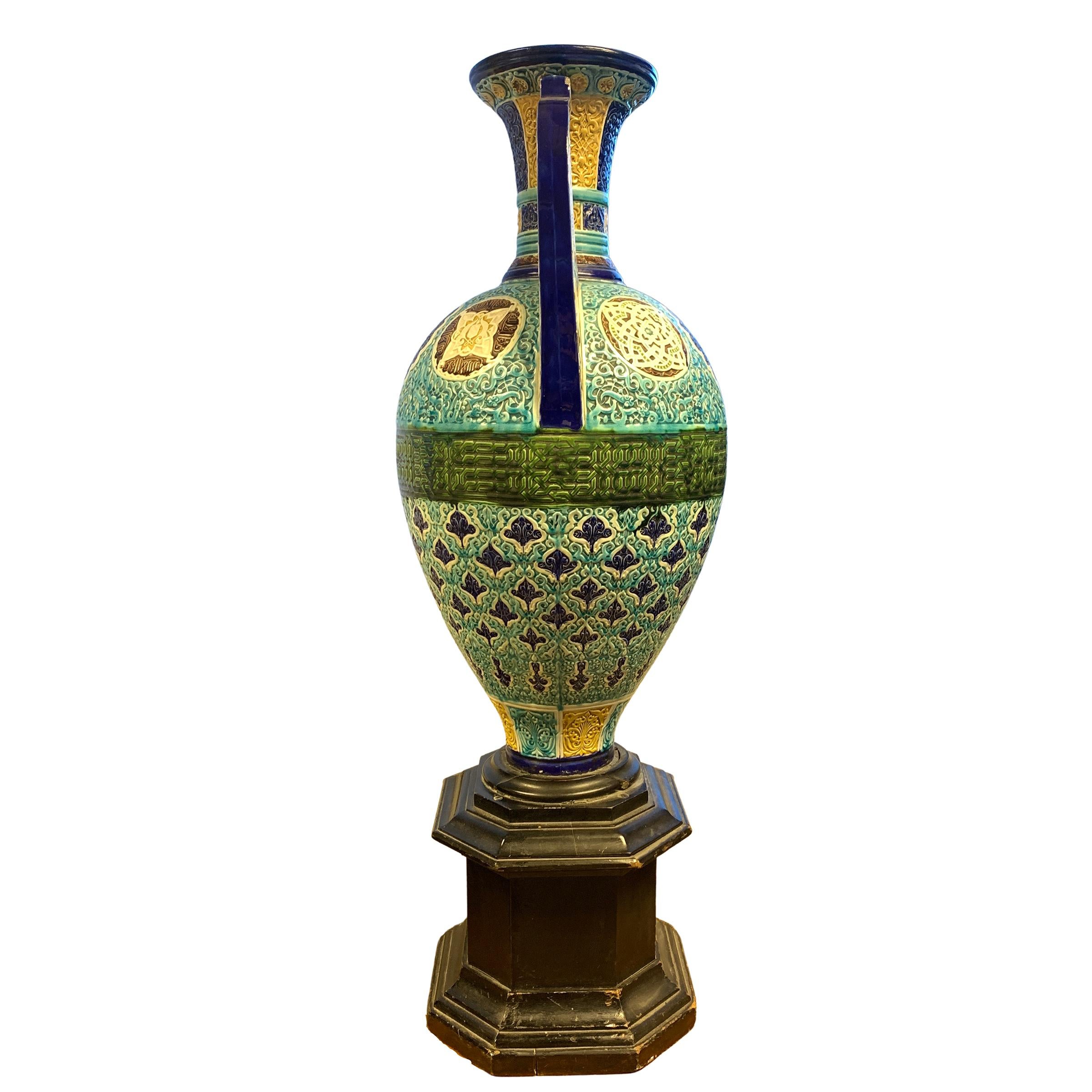 Exquisite quality Alhambra style vase in turquoise, yellow, green and blue with engraving and calligraphy all around the vase. 
  