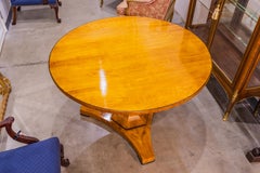 A fine 19th century Cherrywood Biedermeier centertable with ebonized details
