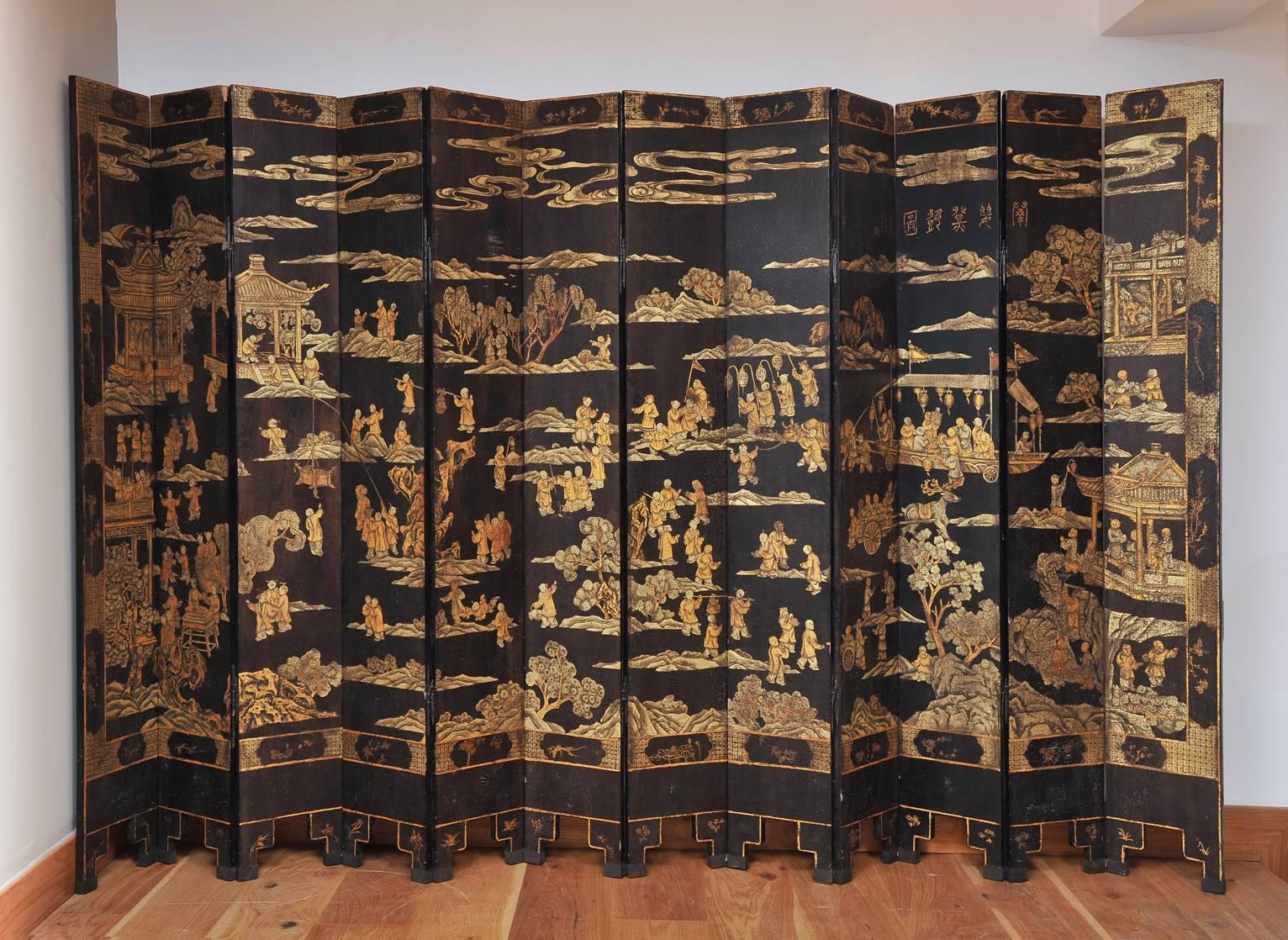 A 19th century Chinese Coromandel lacquer twelve-leaf screen, richly hand-painted with landscapes, vegetation and characters. Its reverse side presents a simpler floral and aviary design.
China, Qing Dynasty, circa 1880.
The height is 214 cm, and