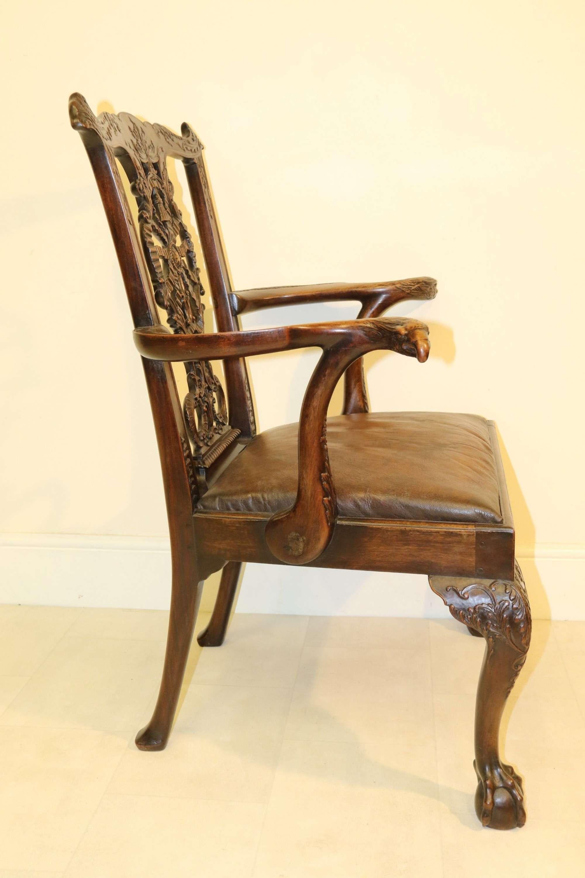 A Fine 19th Century Chippendale Style Armchair

This superb 19th-century example of a top-quality Chippendale open armchair is made from rich dense Cuban mahogany. The workmanship in the intricately carved details on this chair is equal to an