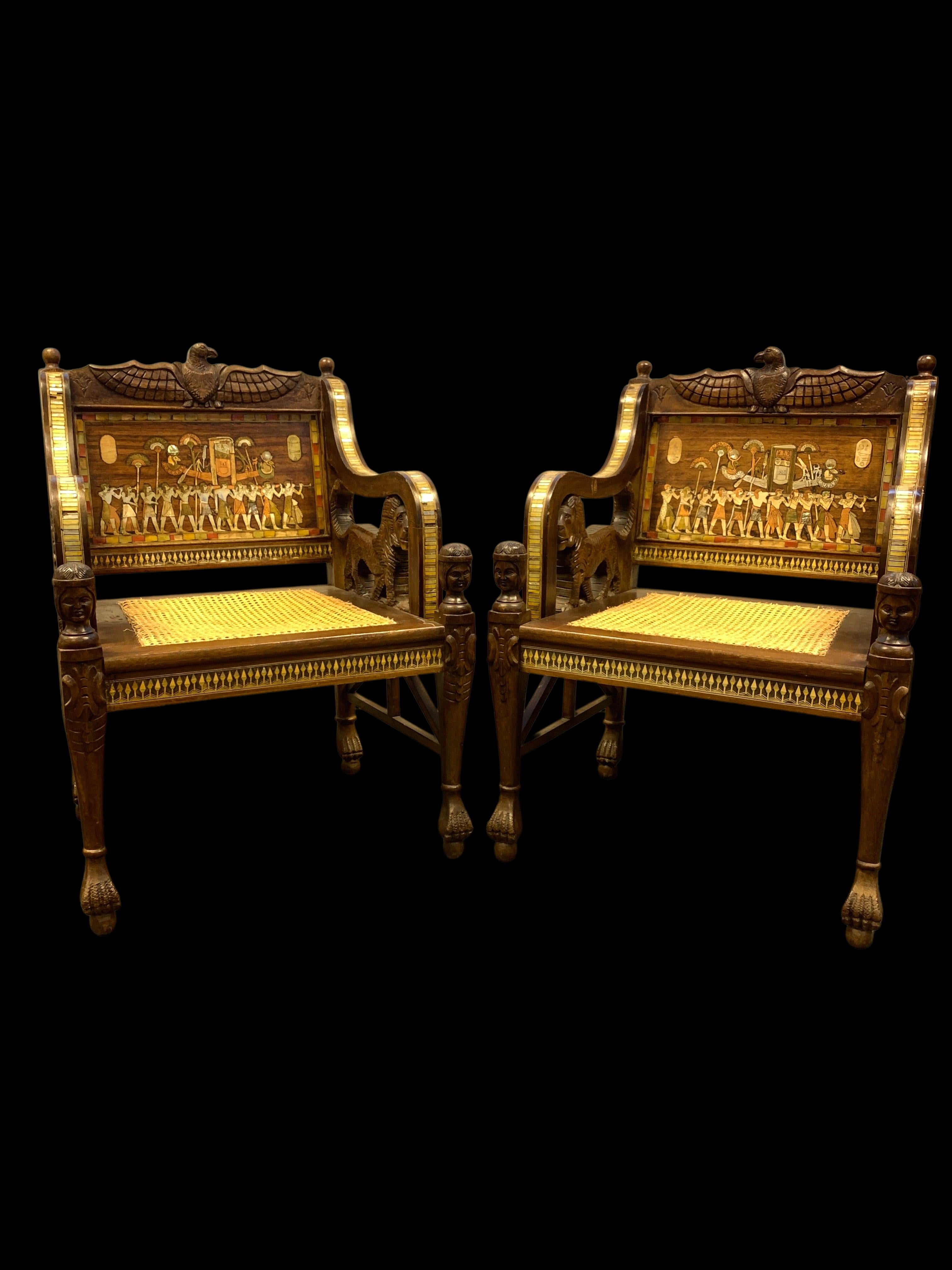 Exquisite and rare set of three Egyptian revival furniture, the set consist of two chairs and a sofa, all three pieces heavily decorated with Egyptian motifs from the Pharaonic civilisation. 

Dimensions: Chairs: H: 92cm, W: 66cm, D: 58cm.
 Sofa: