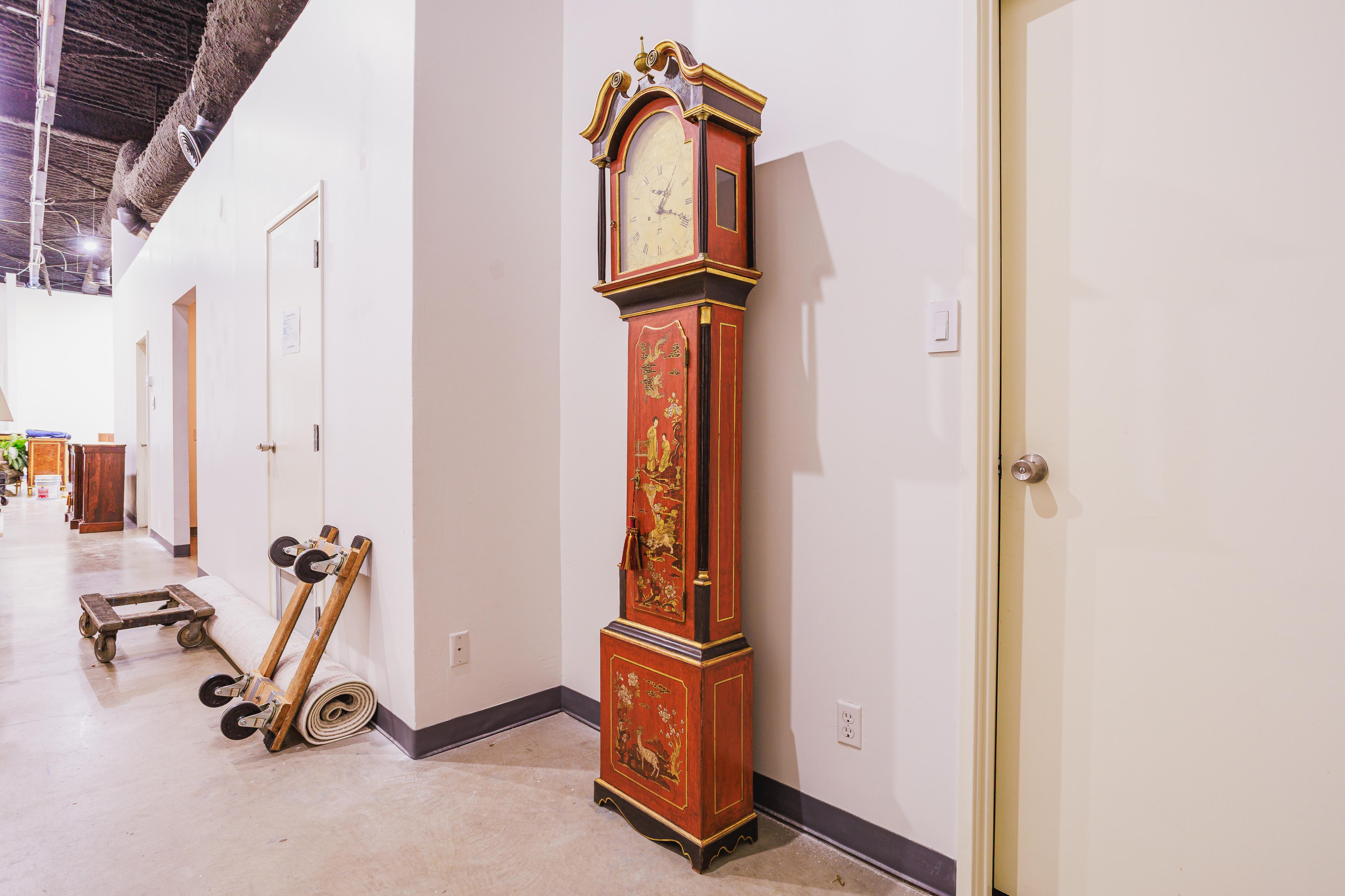 A fine 19tyh century English red painted and decorated Chinoiserie grandfather clock . Working condition and the original works